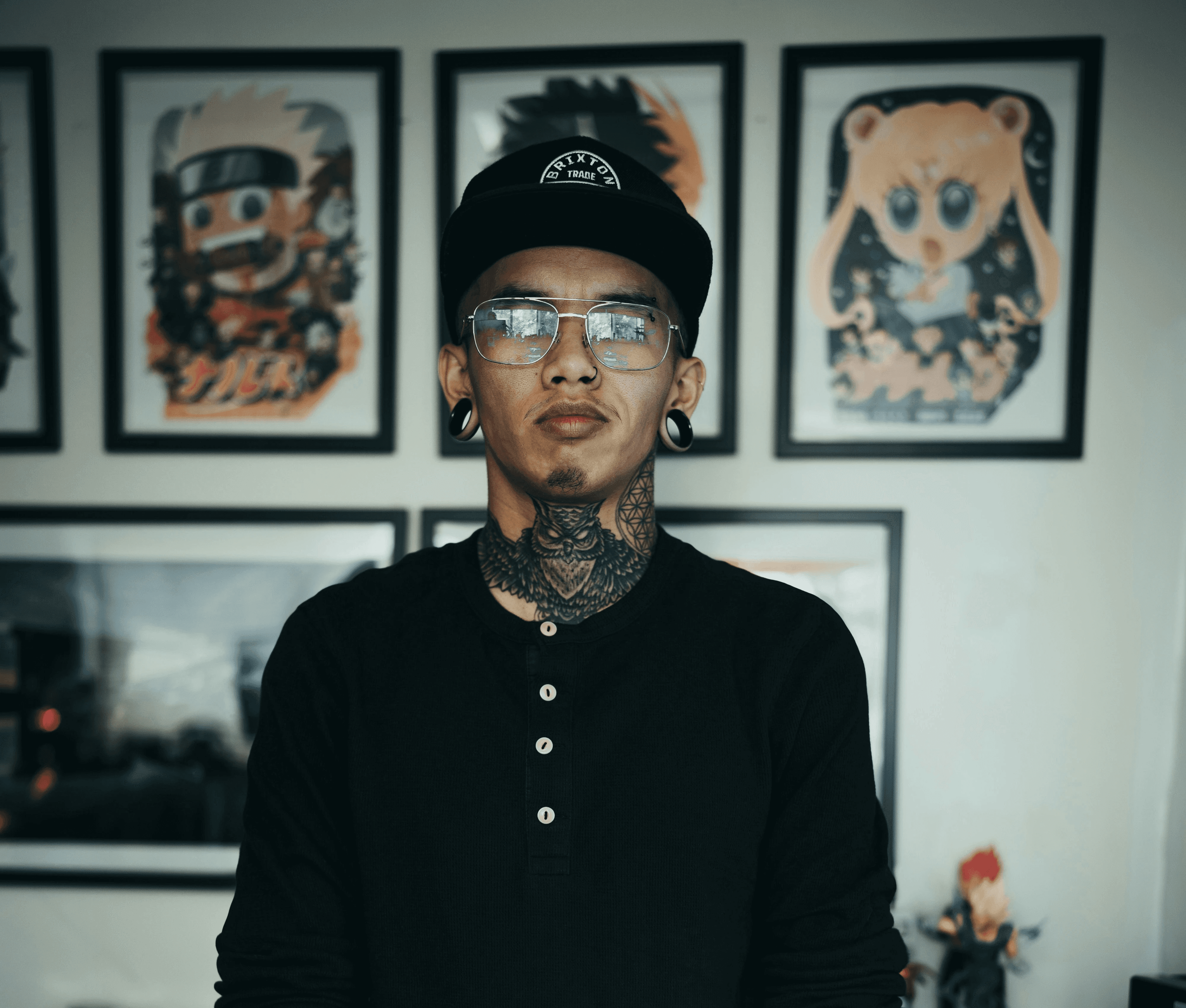 man in black long sleeve shirt with black and red floral tattoo on arm