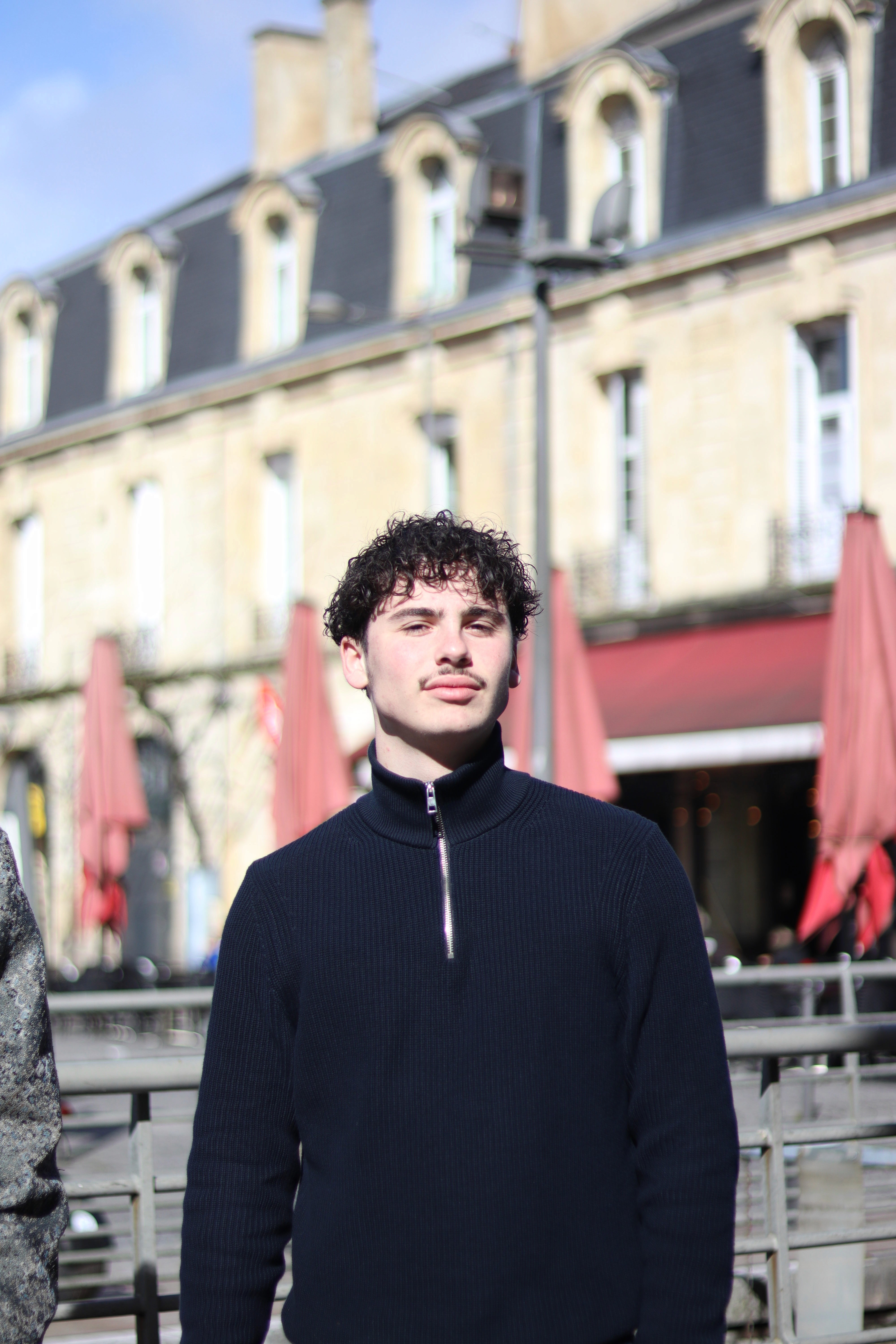 Man's silhouetted profile on red and black background