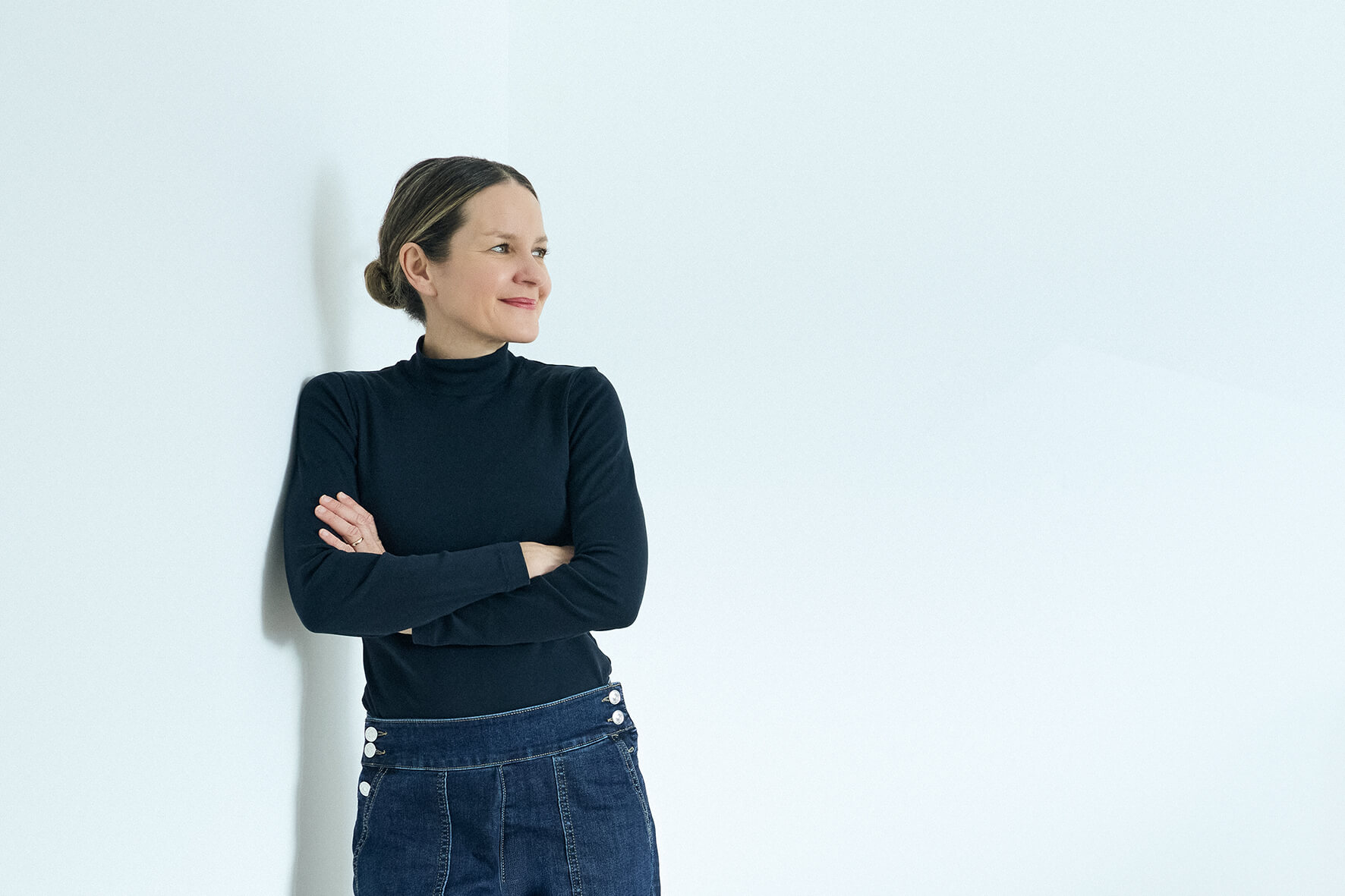 woman leaning on wall