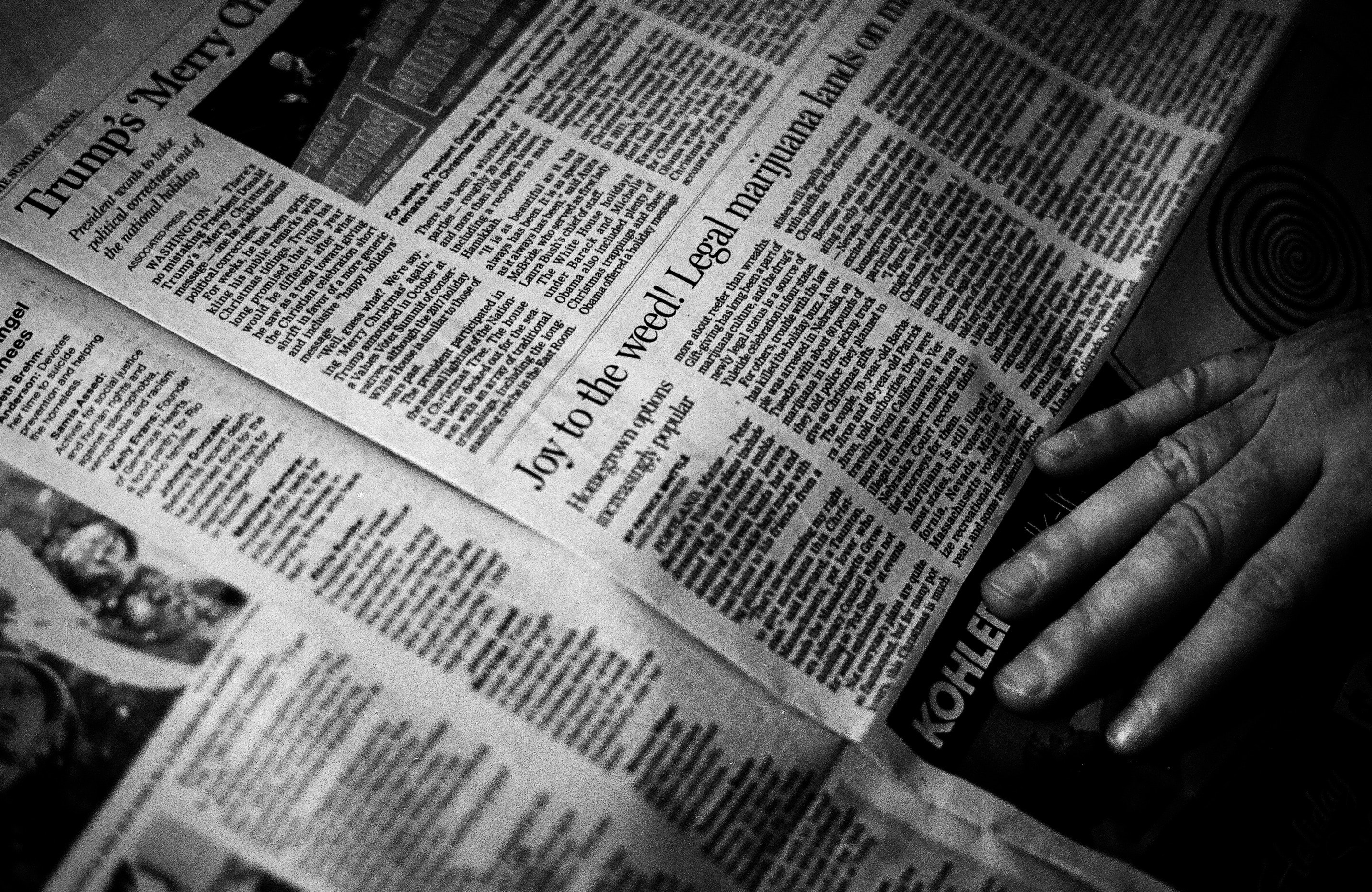 a b&w image of an old newspaper opened