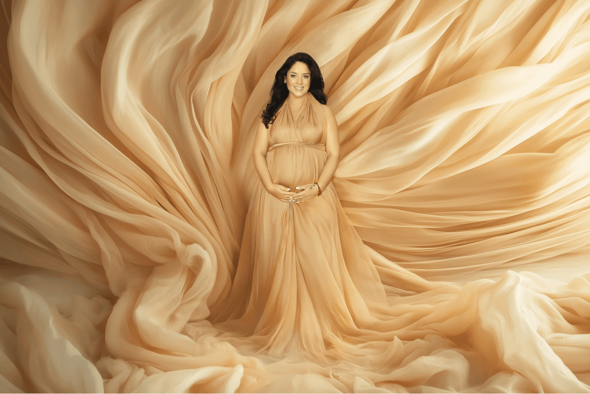 Expectant mother posing gracefully with her hands on her belly during a maternity photoshoot Dubai by Mahvin Photography in UAE.