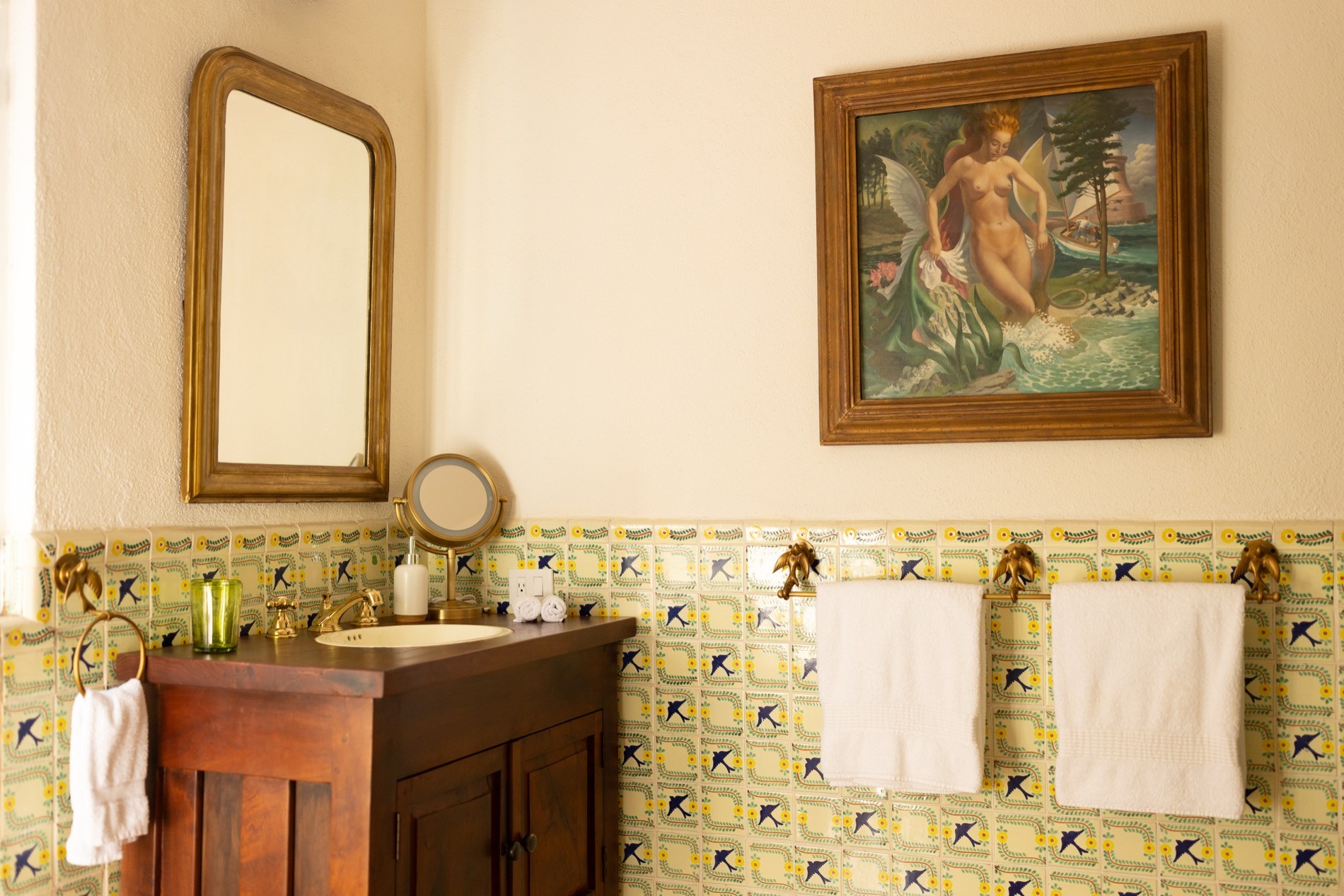 La Residencia hand-painted Talavera sink with brass fixtures and swallow tile detail