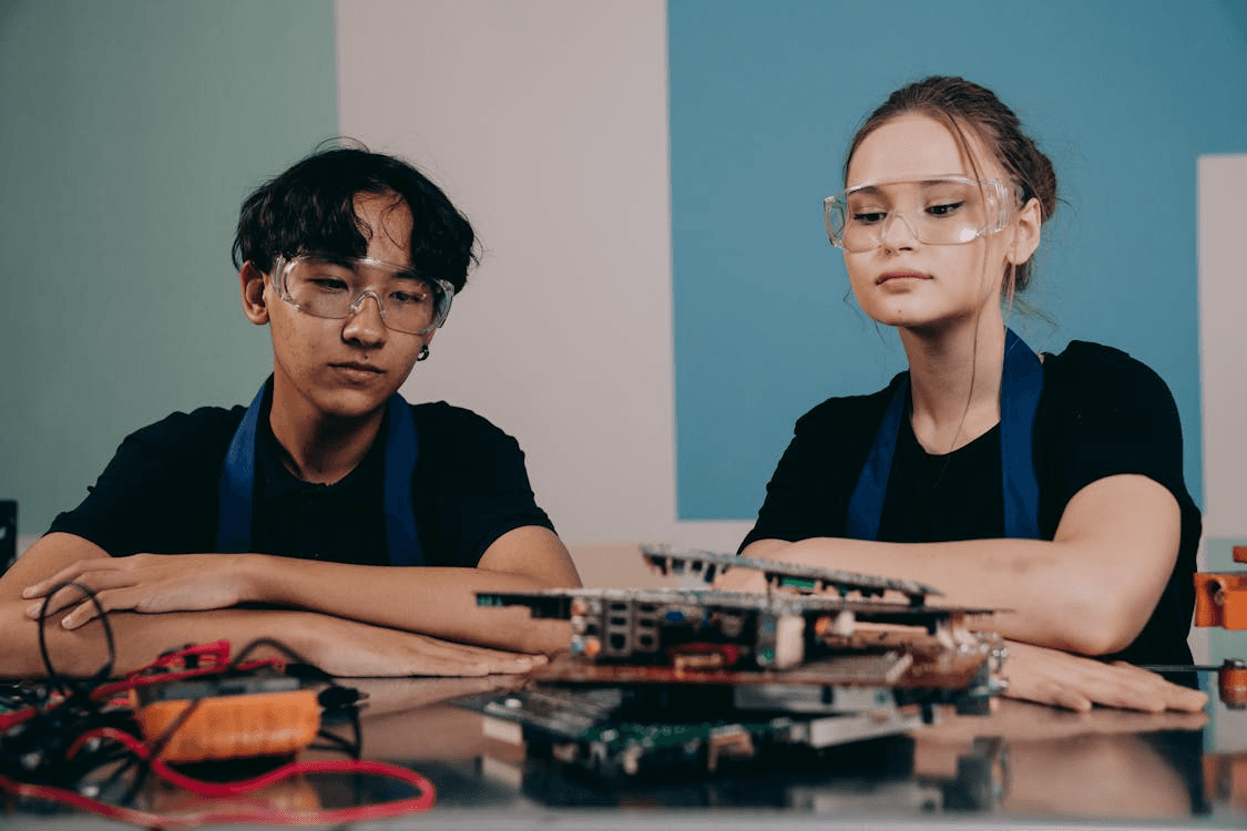 Woman and Man Sitting by Table with Hardware