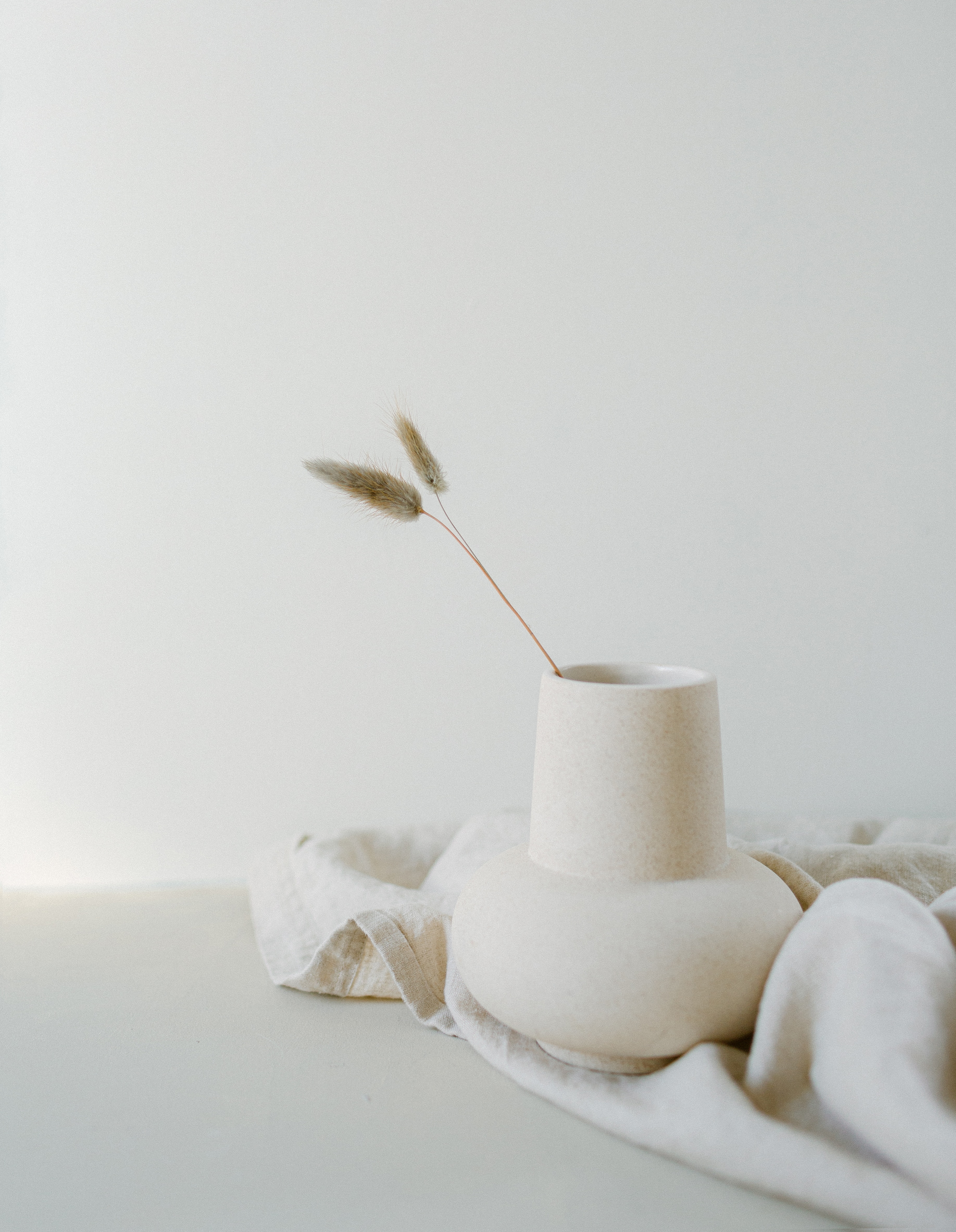 A vase with wheat inside