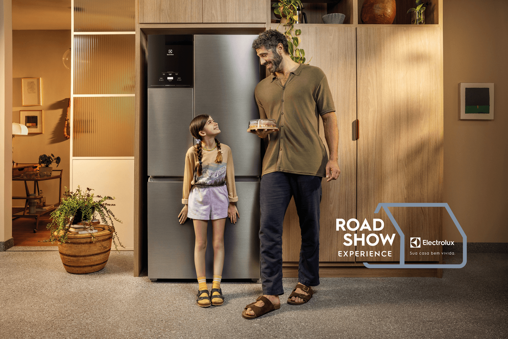 Smart speaker with a glowing top, placed on a circular base in a dark room.