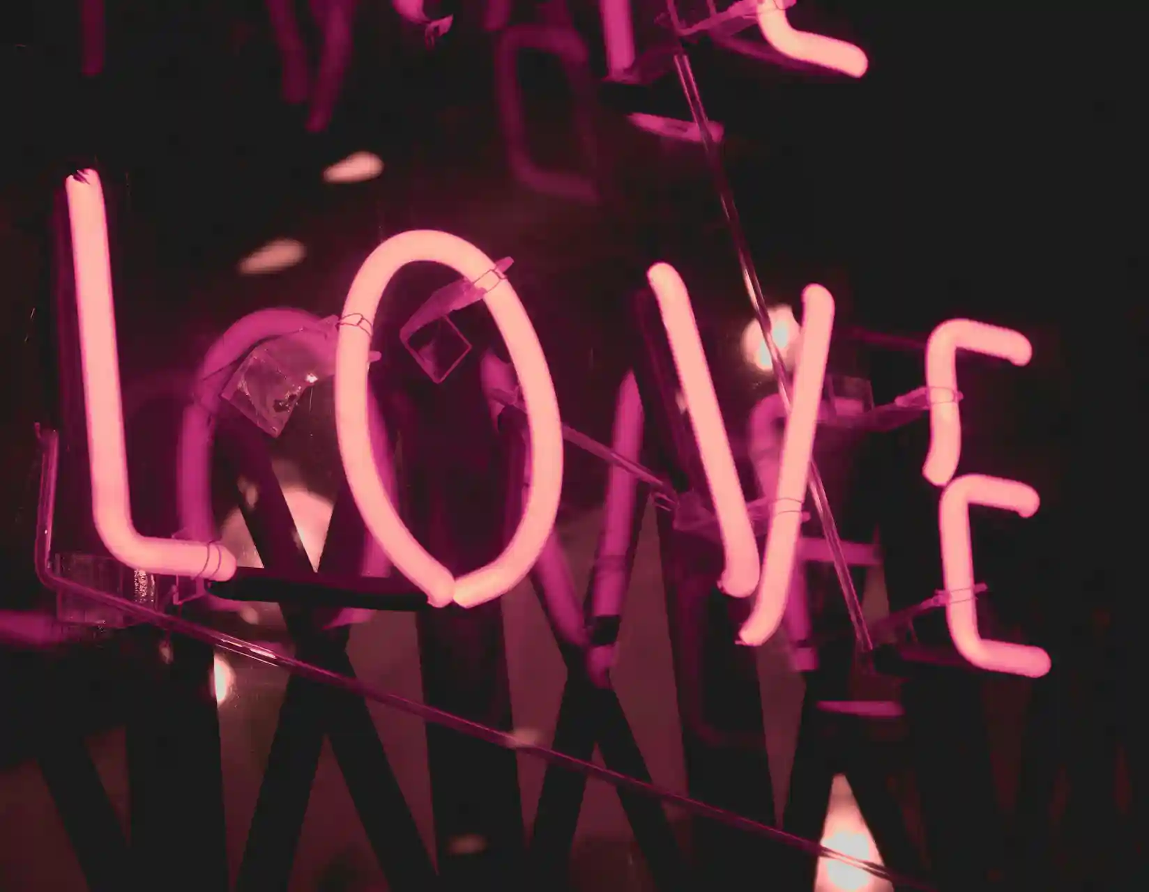 pink neon lights spelling the word "love"