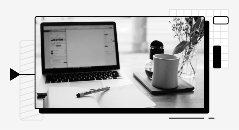 Coffee, plant, and a laptop.