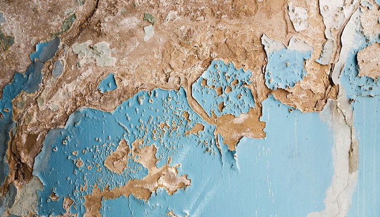 Paint peeling on the wall