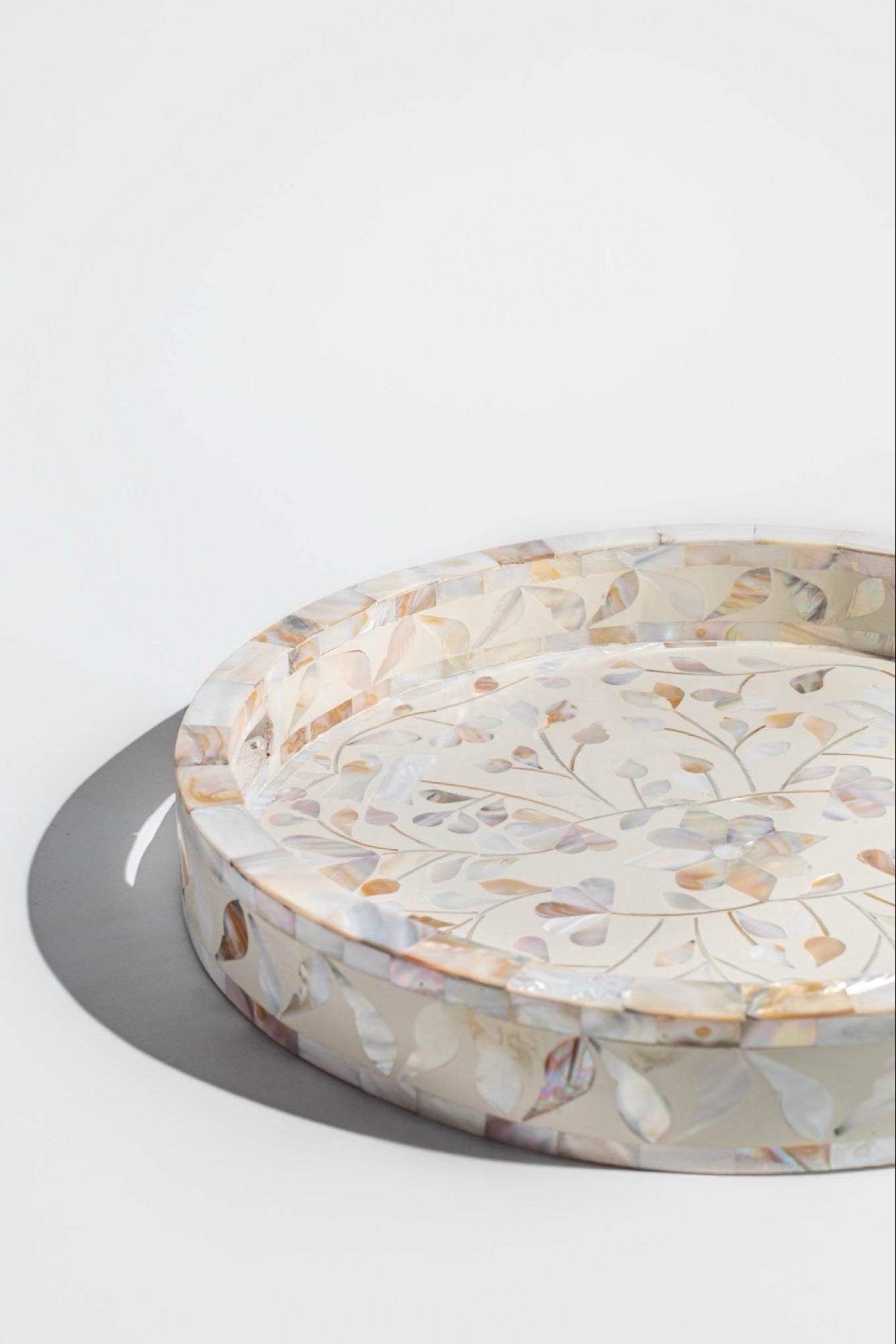 Round pet bed with floral pattern on a white background