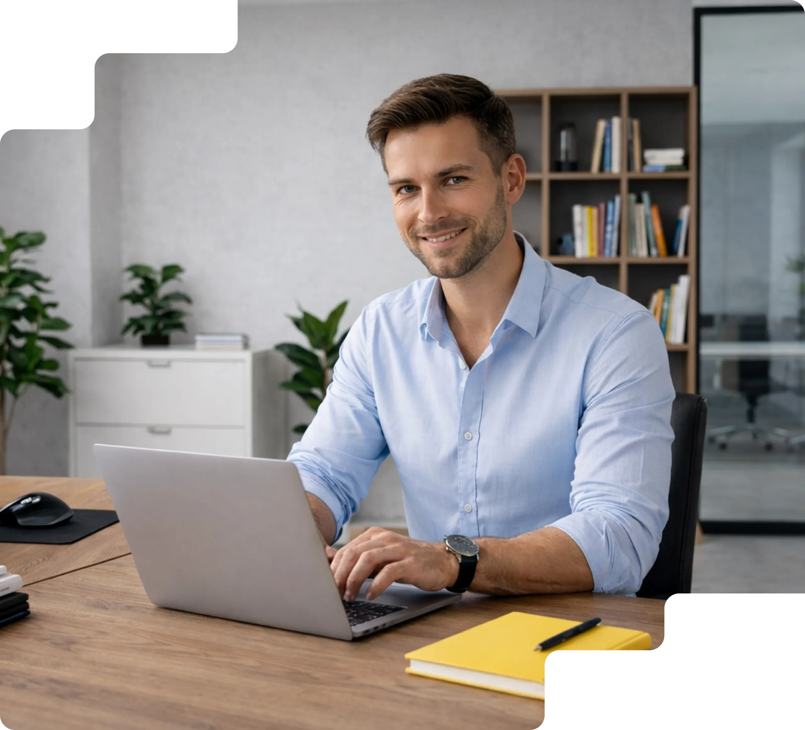 Person working on a laptop at a desk.