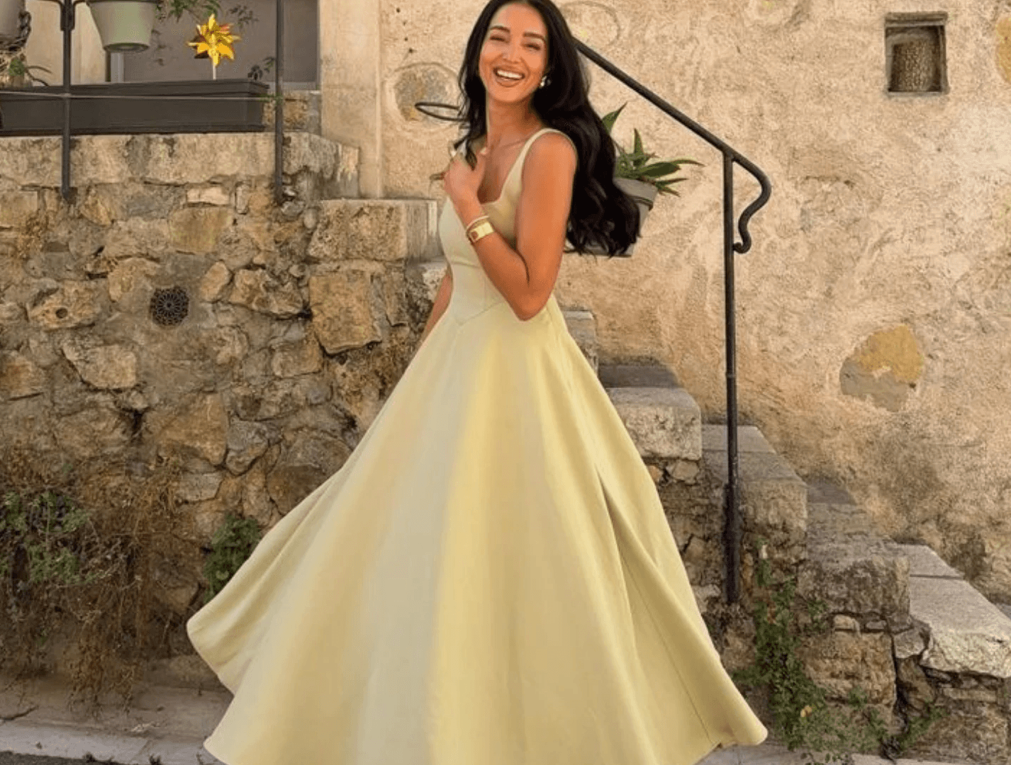 Man places ring on woman's finger with blue background