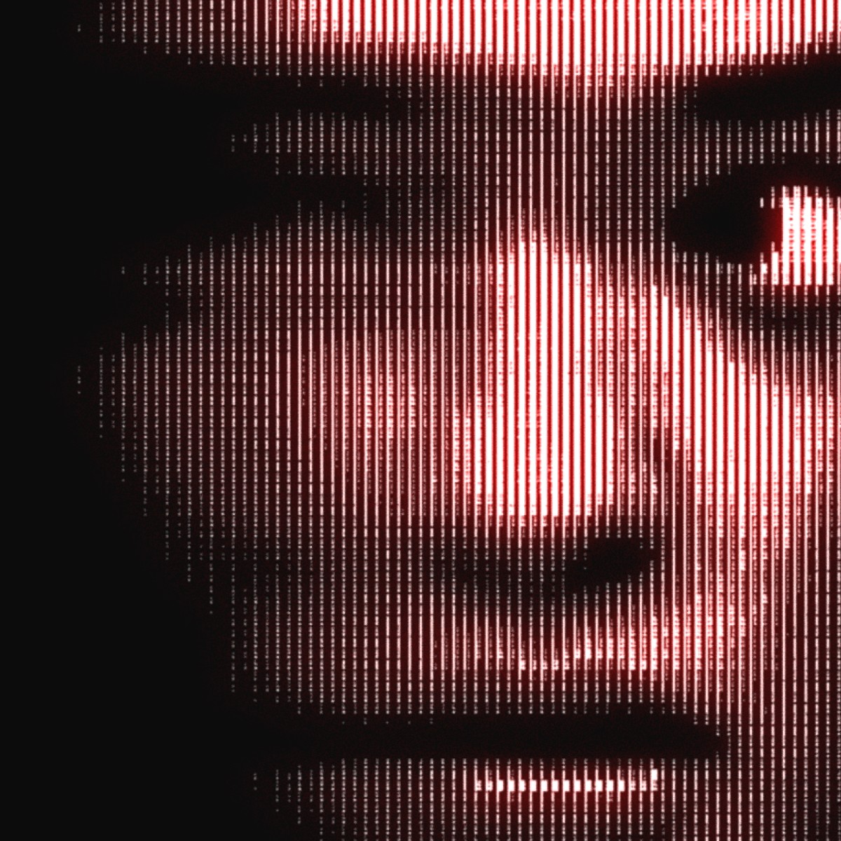 man wearing grey t-shirt standing in front of man sitting on chair