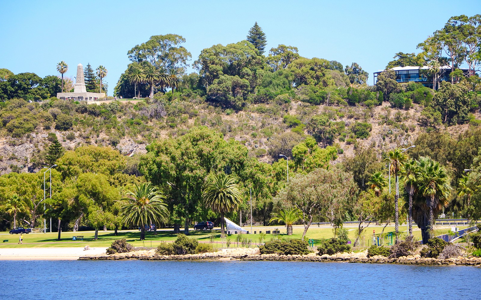 Kings Park landscape with lush greenery and war memorial in Perth, Australia.