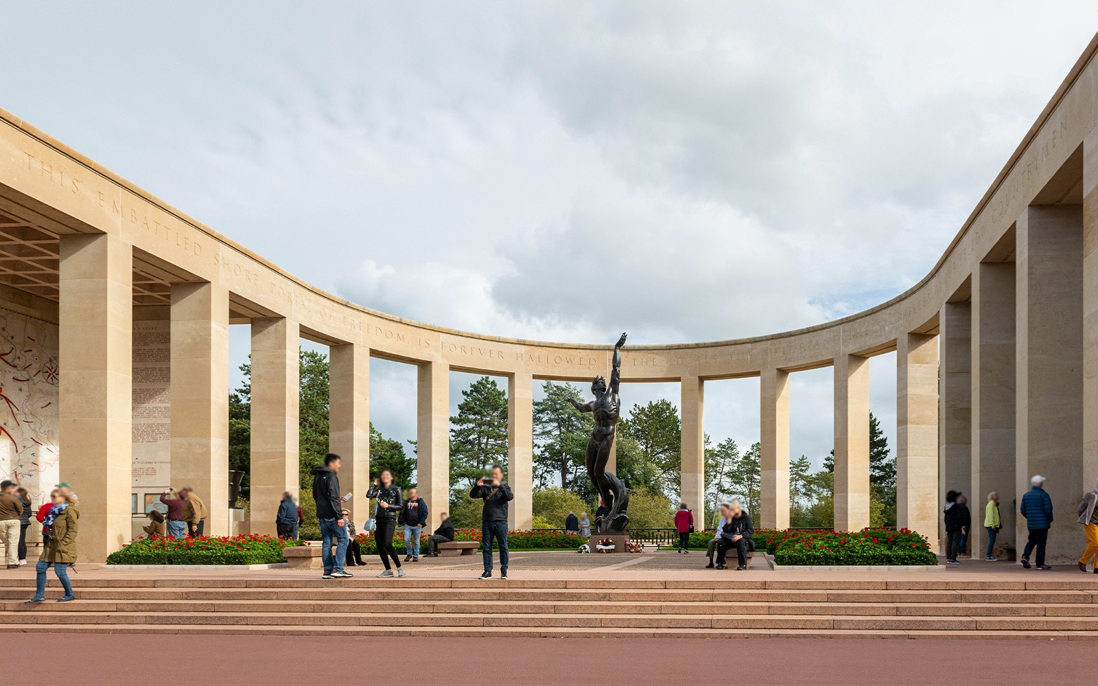 Visitors at Normandy American Cemetery memorial, WWII D-Day tour from Paris.