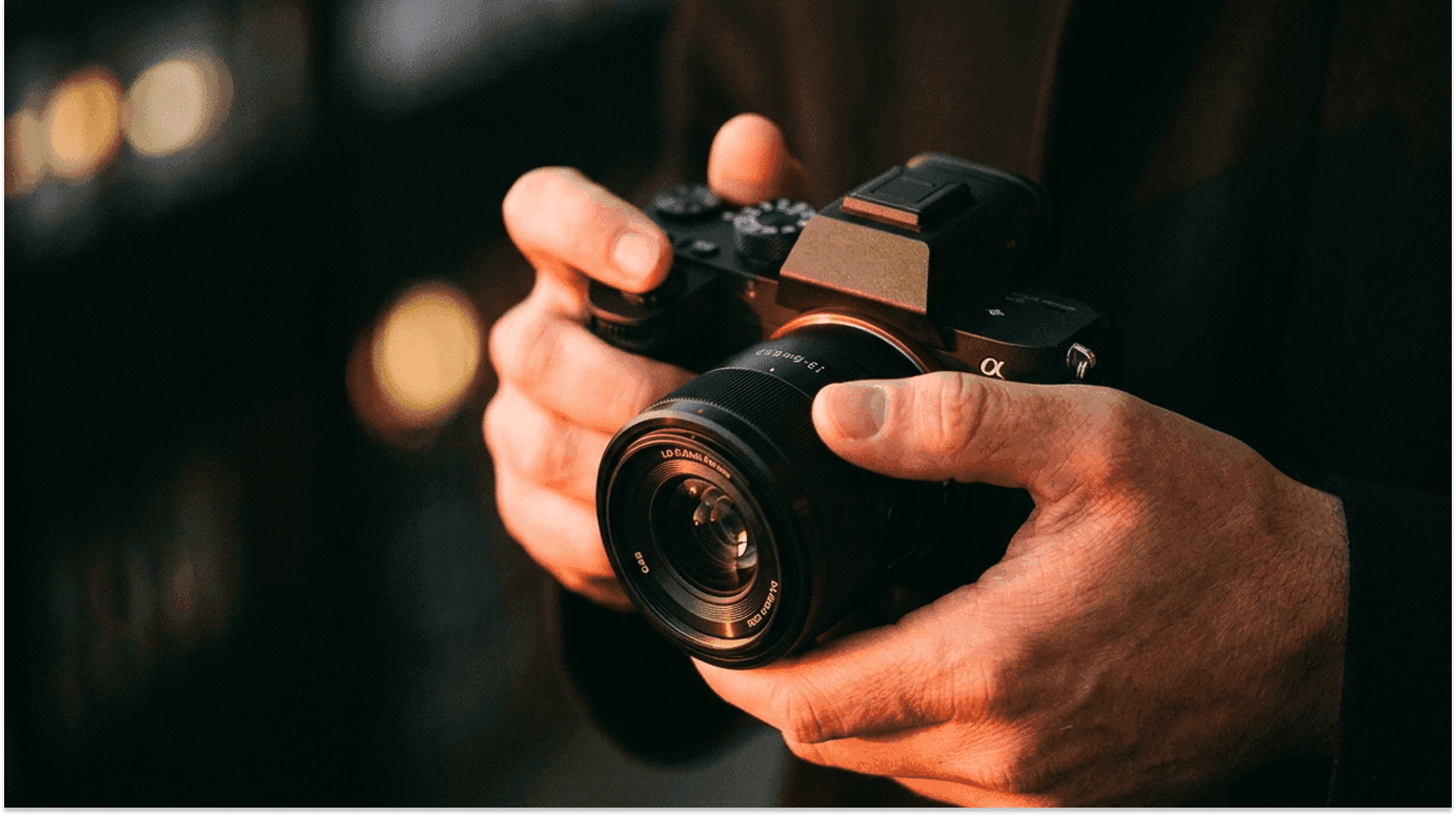 Fit woman with short hair looks upward in warm lighting.