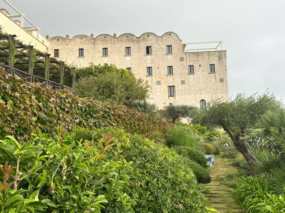 The former monastery building of Monastero Santa Rosa seen from its terraced garden.
