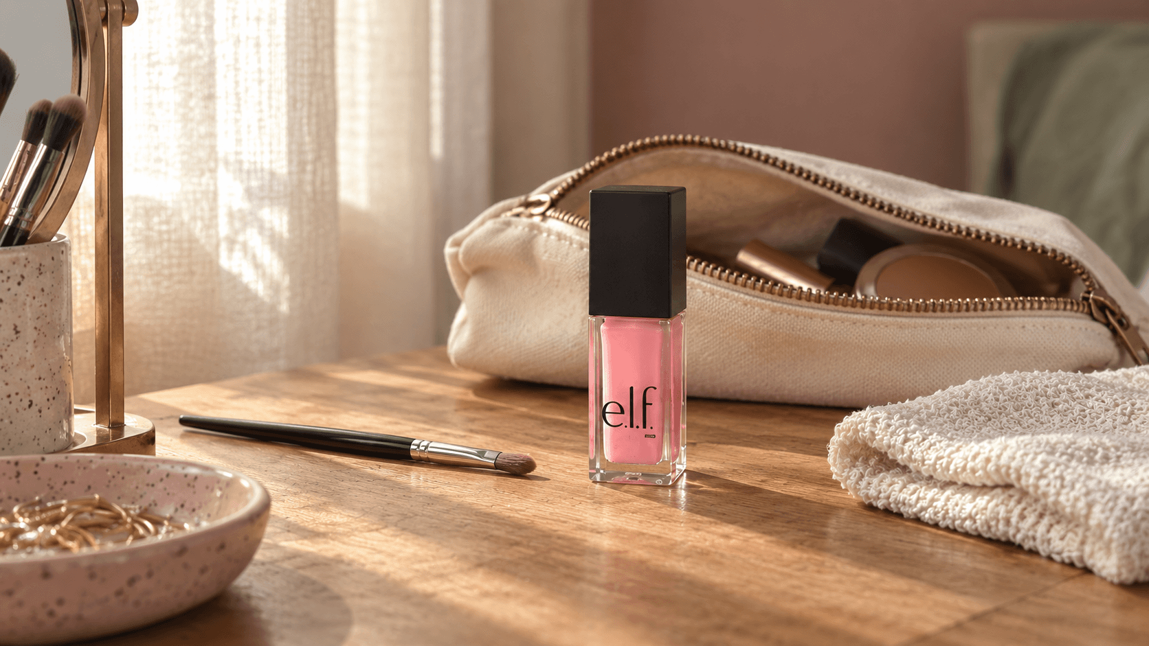 An e.l.f.-inspired product detail beside a makeup pouch in soft window light.