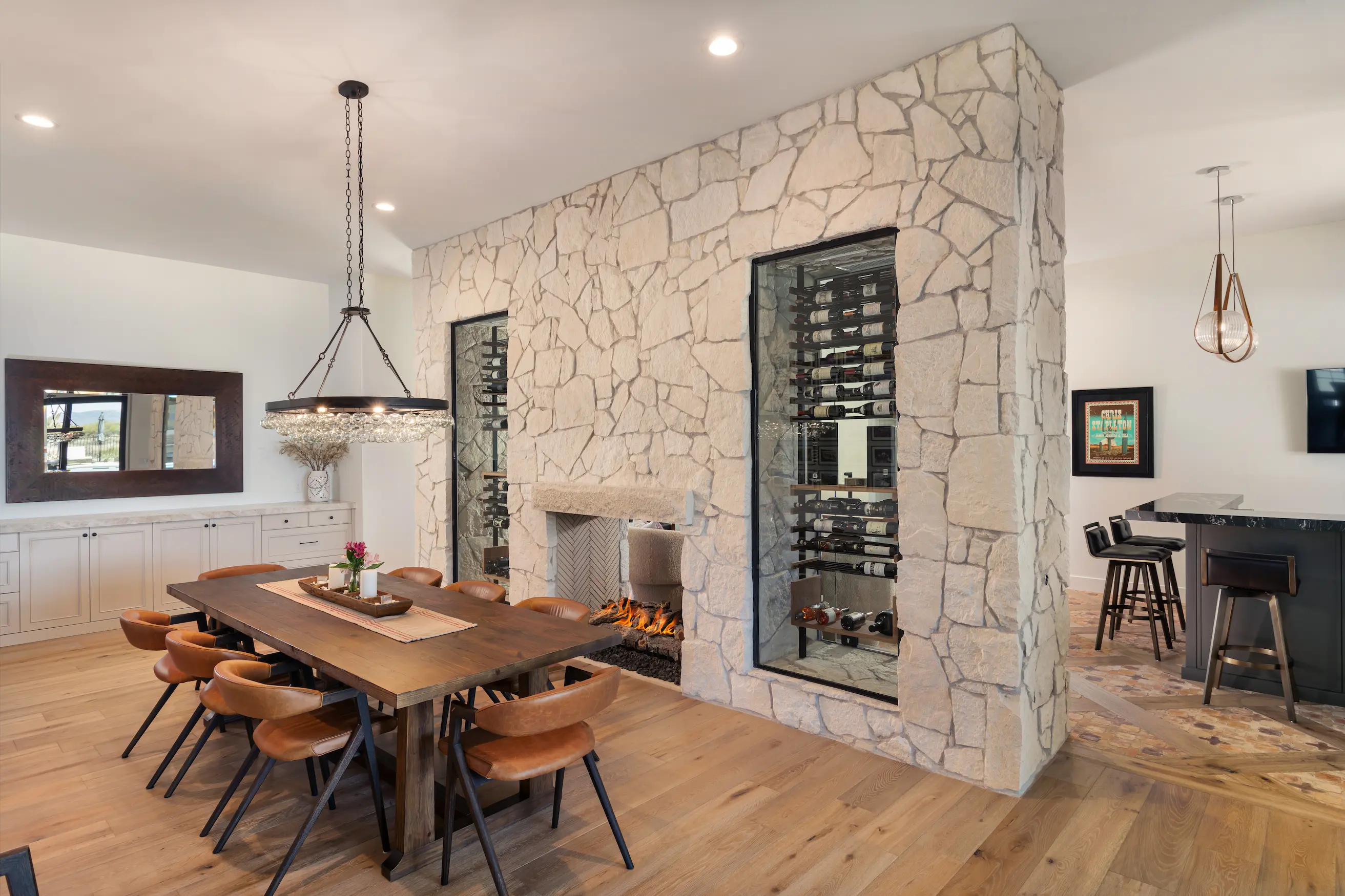 the entire room interior, ocean horizon visible, king bed neatly made, airy curtains flowing in the breeze.