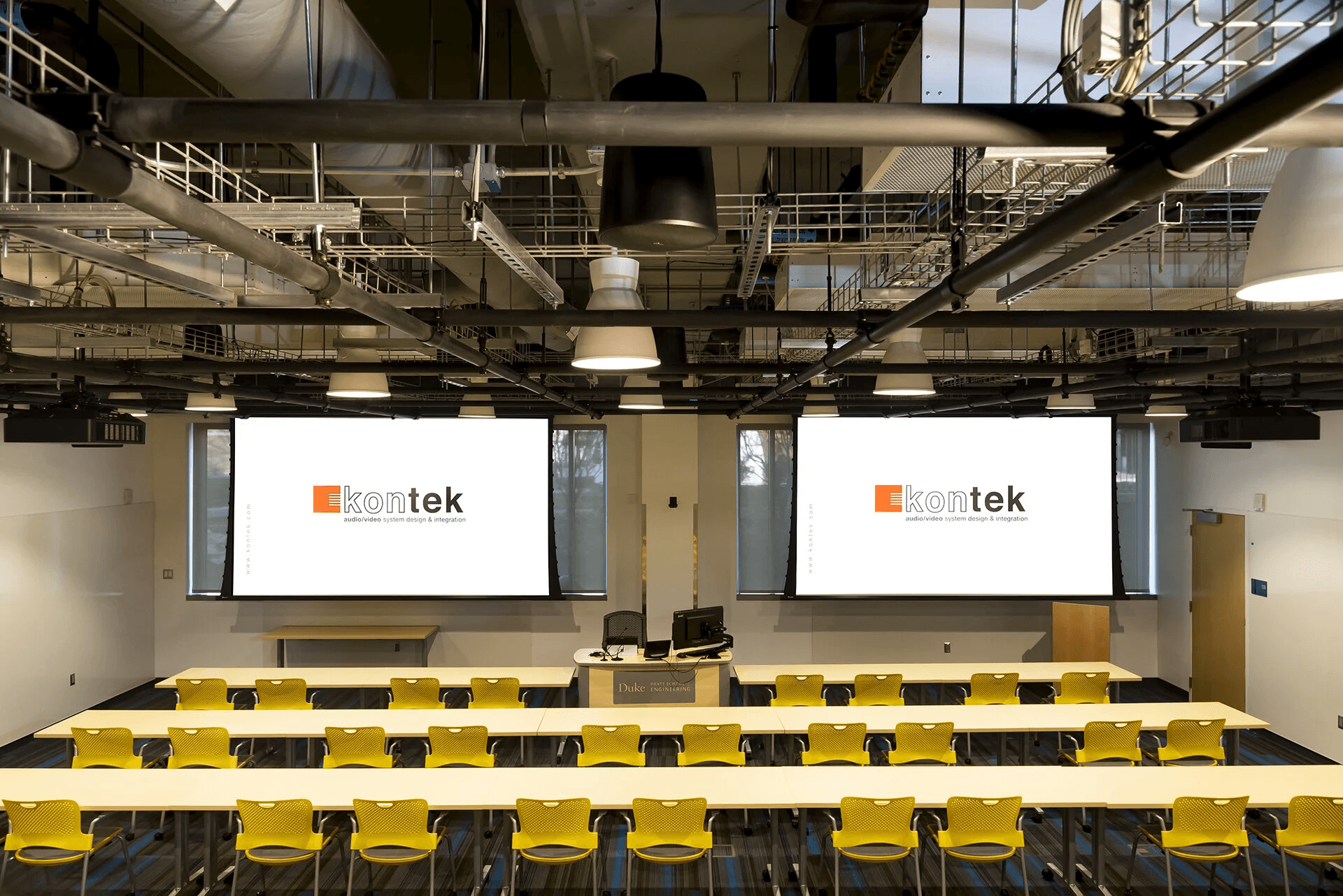 people sitting on chairs watching a game