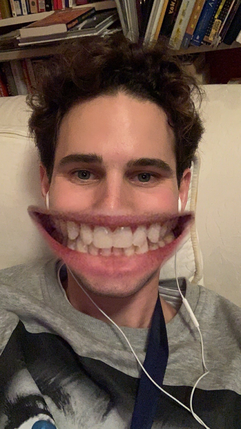 The owner of site smiling. Mouth has a goofy filter, enlarging it.