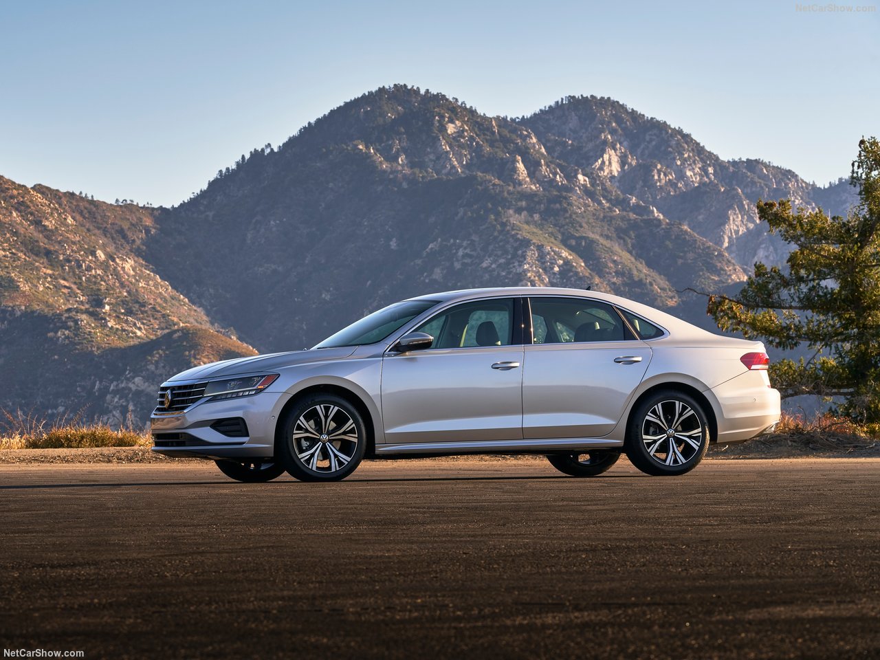 Side view of the Volkswagen Passat US version parked in front of a mountainous landscape