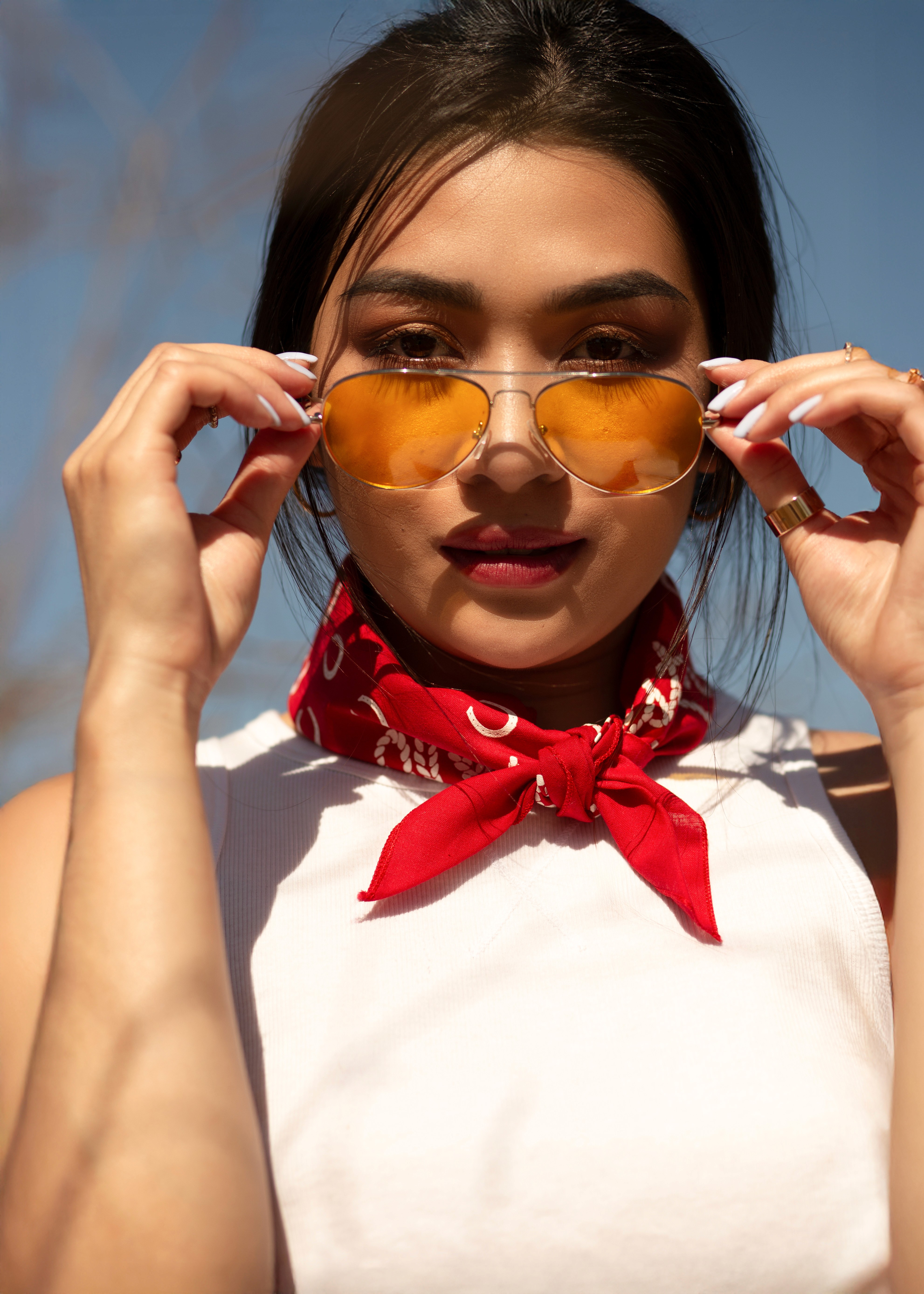 Model looking through sunglasses