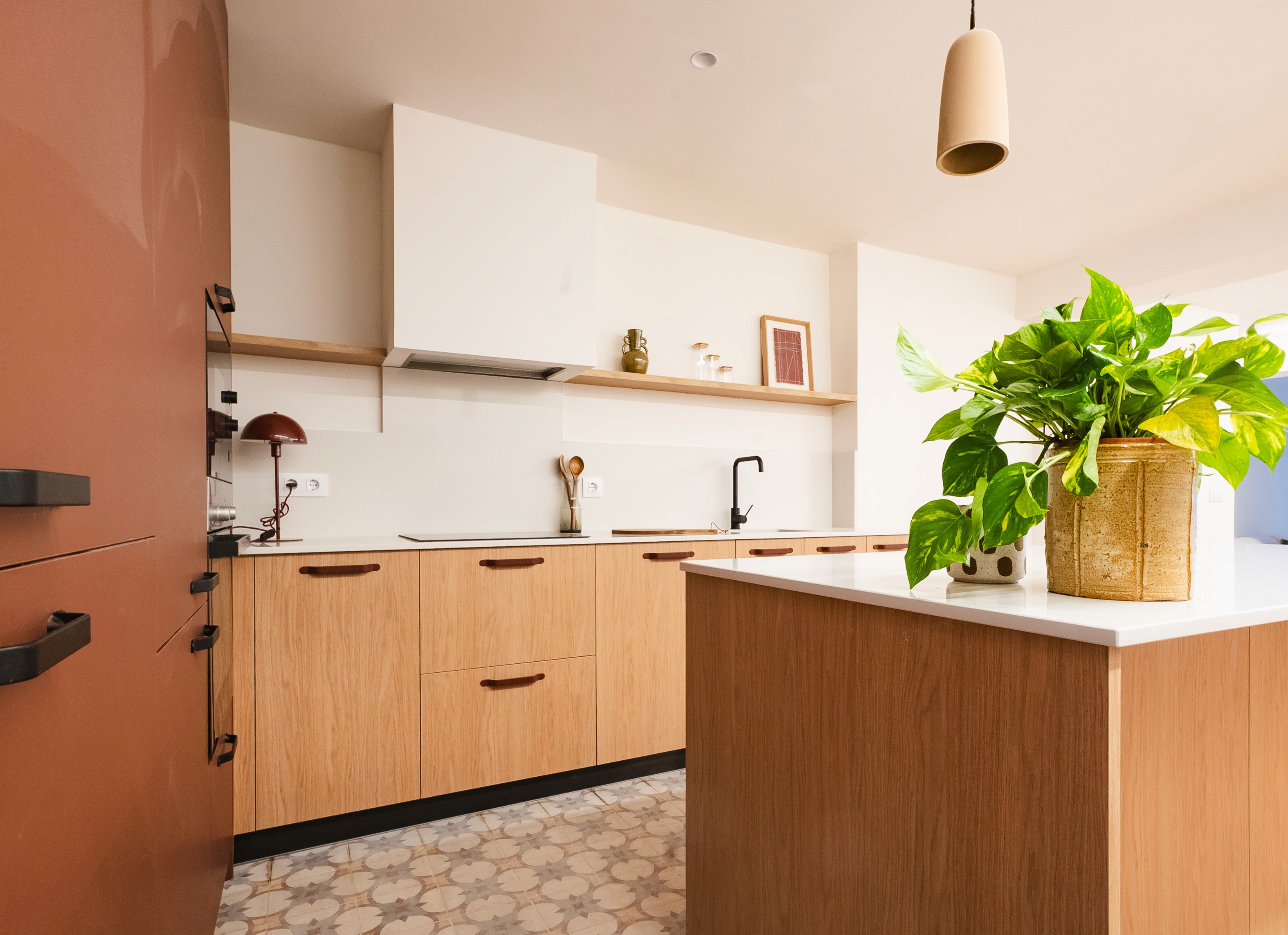 Photo of a beautiful light kitchen with big windows