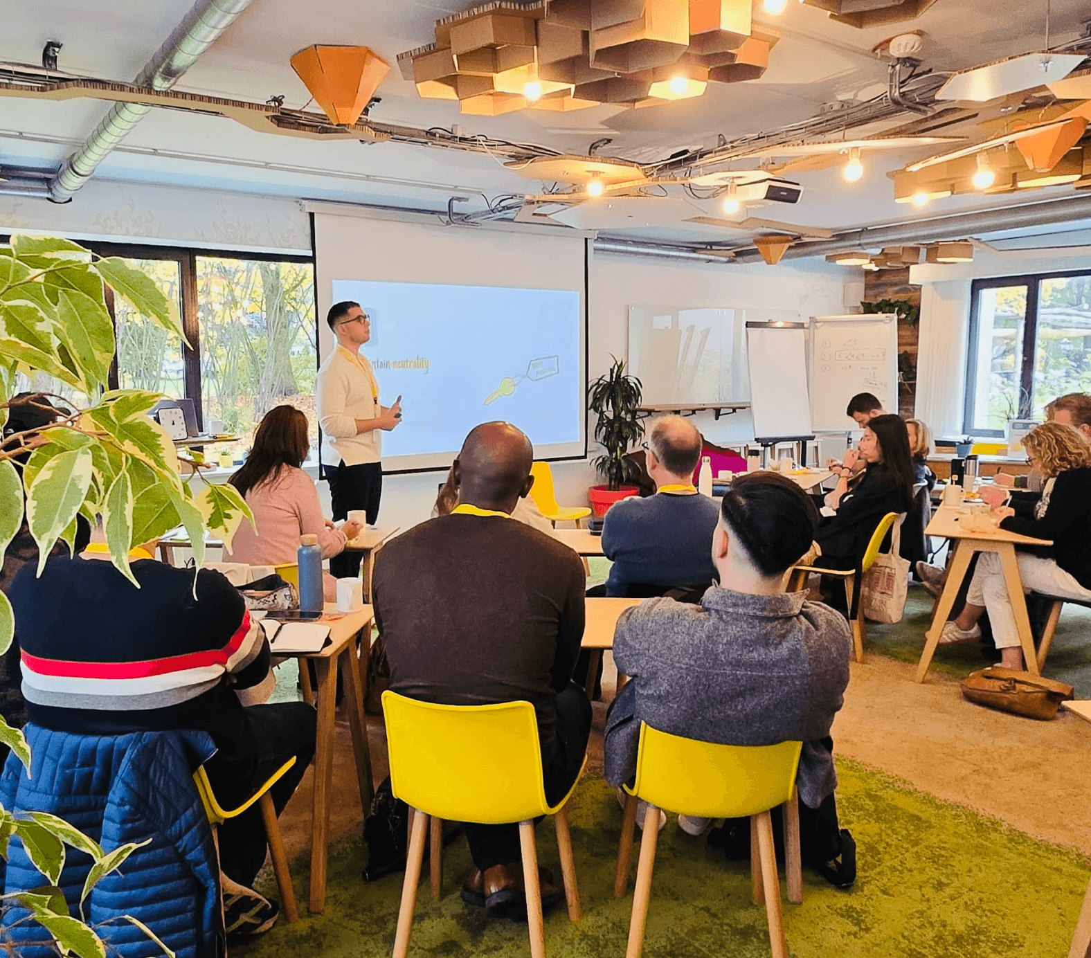 Design Thinking workshop with a group brainstorming and engaging in creative activities.