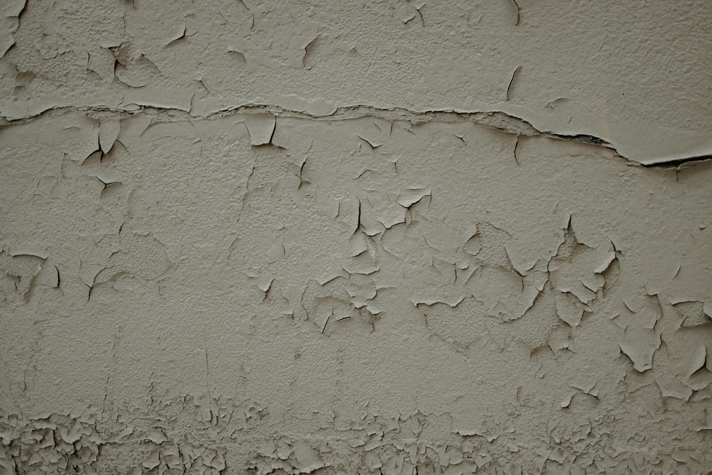 A wall that has some cracks in it