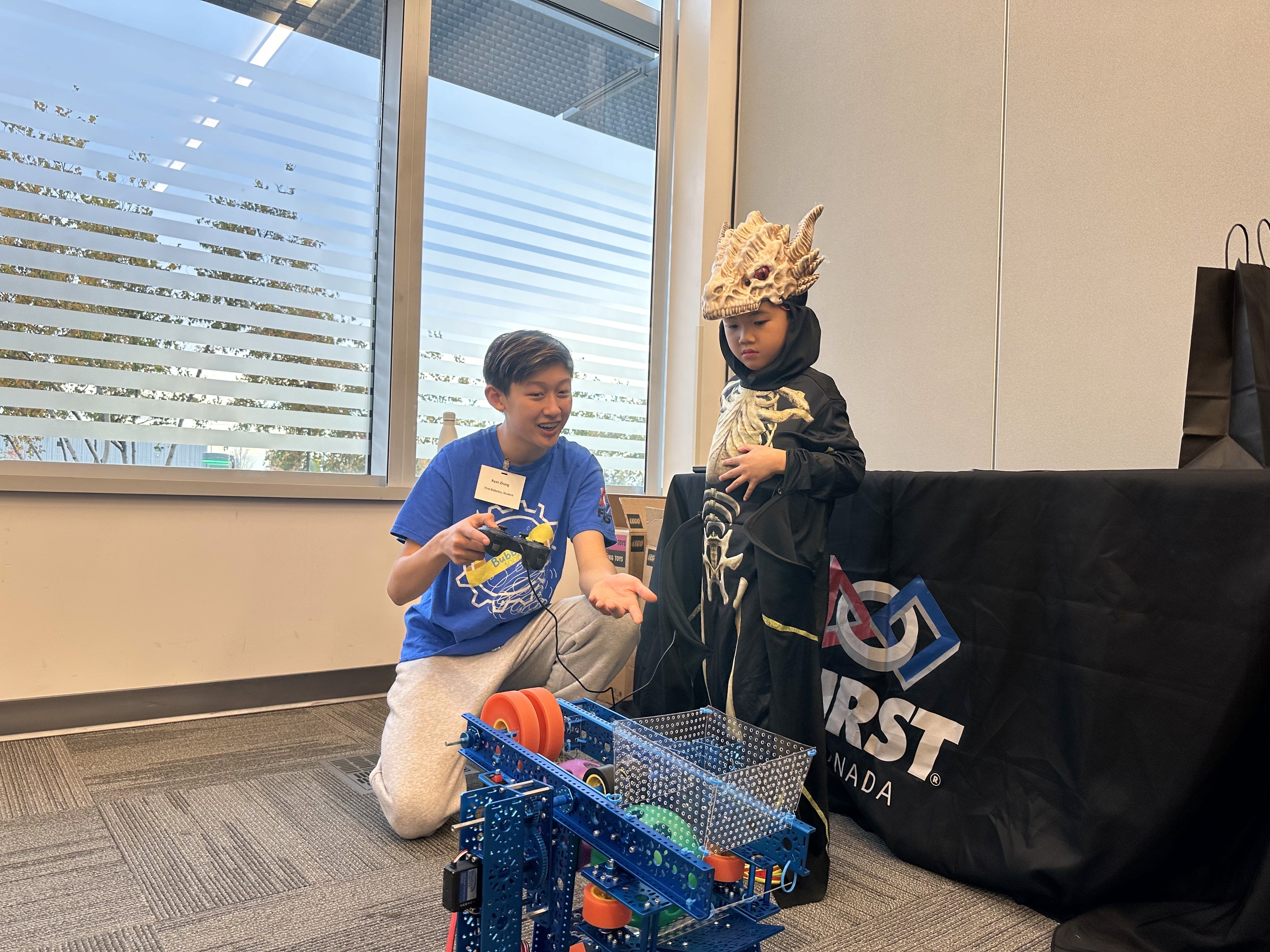 Ryan Zhang leads FRC 10015 Bubbles outreach demonstration at Honda Headquarters, promoting FIRST robotics and STEM education.