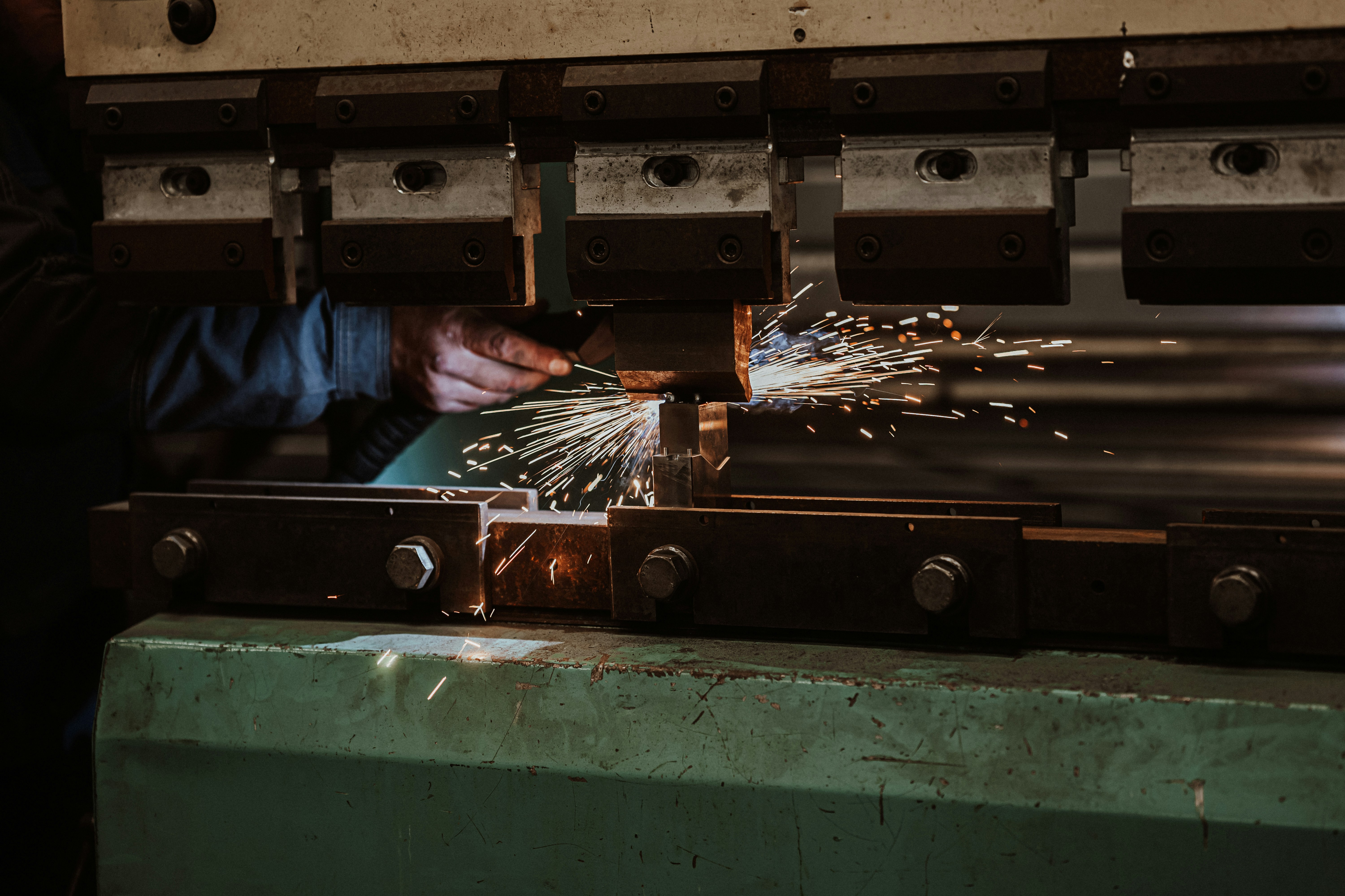 a person working on a piece of metal
