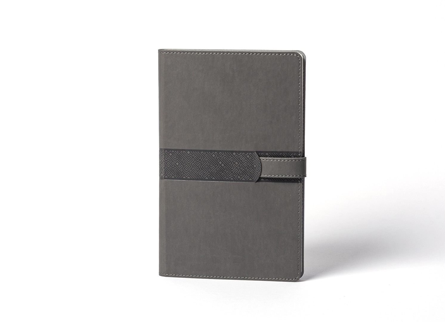 Front view of grey notebook with textured central geometric band.