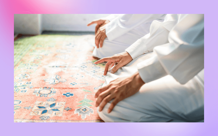 Close-up of worshippers sitting in rows on a patterned carpet during Jummah prayer, illustrating the communal aspect of the prayer.