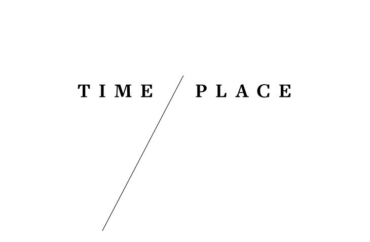 An open book titled "TIME PLACE 1980-1988 IRAN" rests on a white surface, showcasing a predominantly white cover with purple text and a photograph of a mountainous landscape. The book is positioned diagonally, with its pages facing upwards, inviting readers to explore the narratives of the Iran-Iraq War.