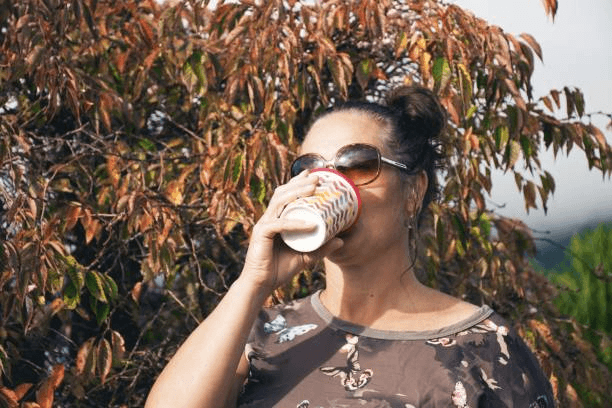 Traveler sitting at a café in a charming small town in New Zealand