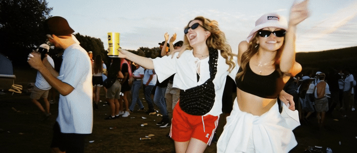 Sun setting behind hazy desert mountains at dusk