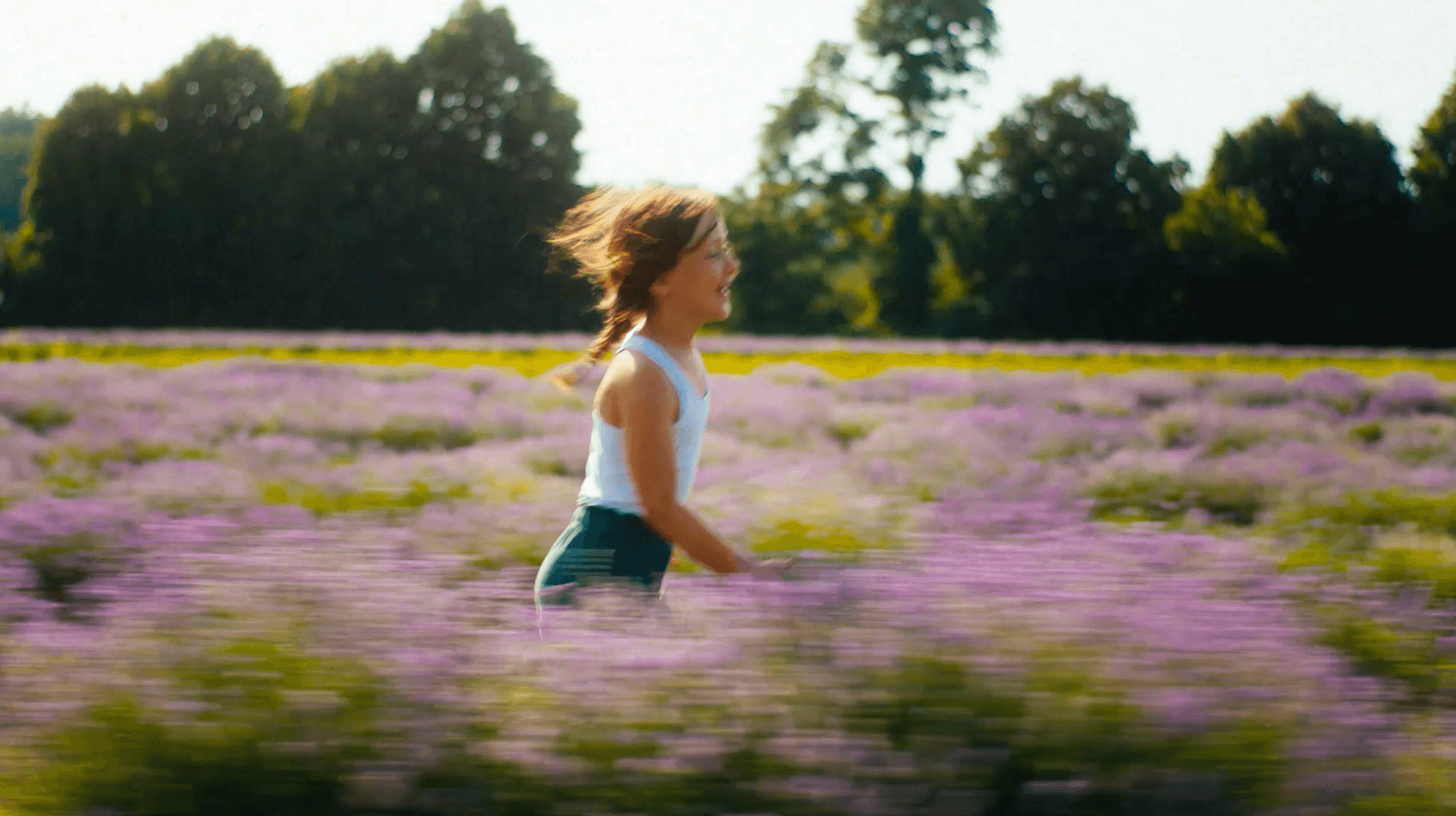 Young girl running in a lavender field
