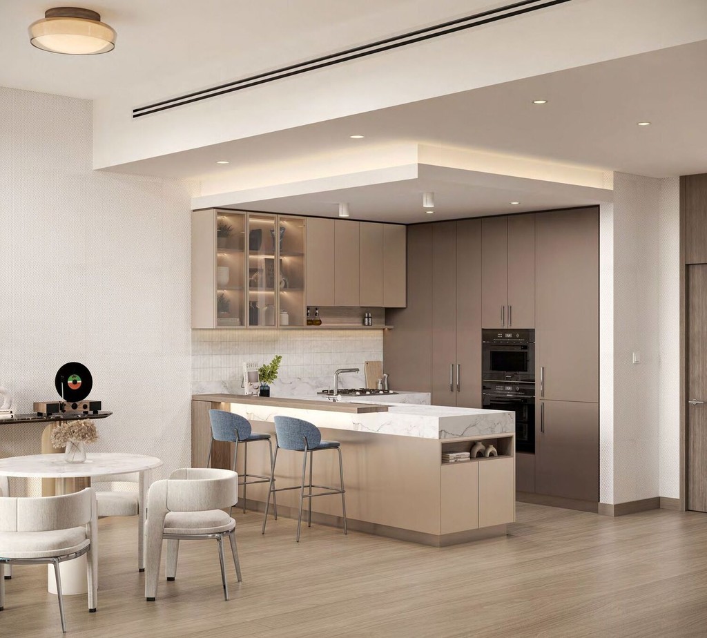 Modern kitchen and dining area in Windsor House II, featuring sleek appliances and contemporary furnishings.