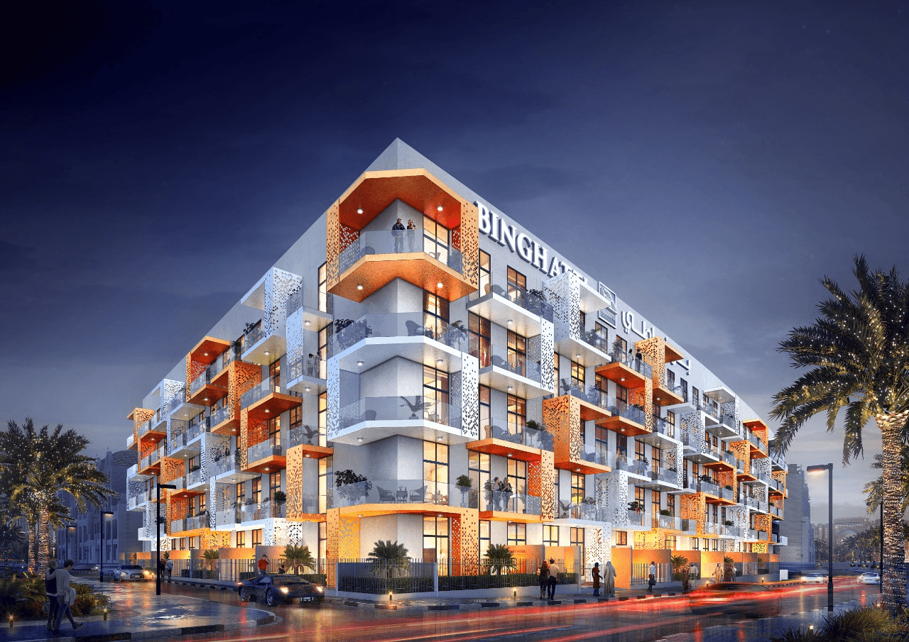 A group of vultures perched on a dead tree branch.