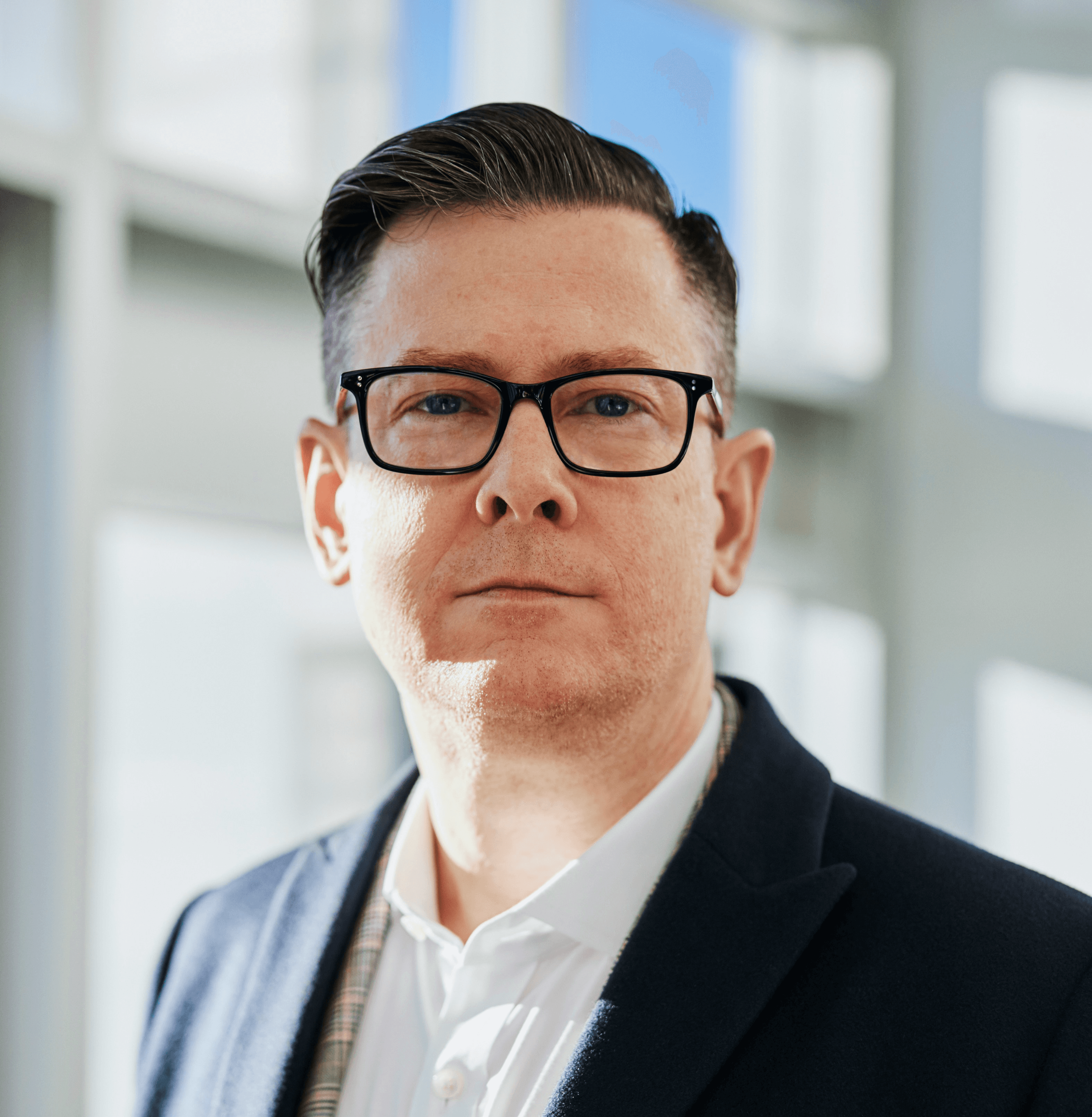 man standing beside wall