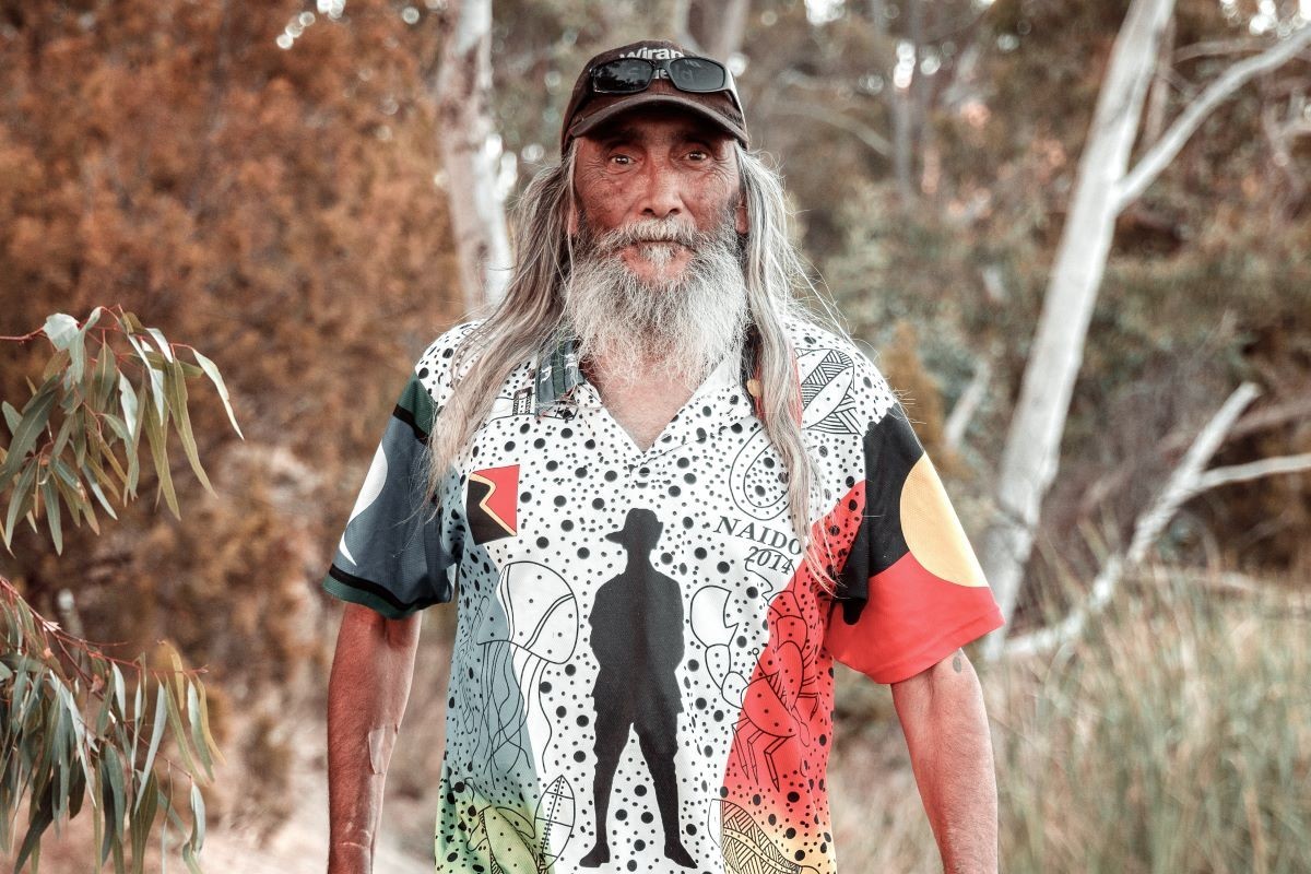 Uncle Rick Nelson, a Jaara elder, standing and welcoming visitors to Castlemaine Art Museum’s homeland on Dja Dja Wurrung Country, acknowledging the custodianship of the land, waters, forests and granite country around Liyanganyuk Banyul.