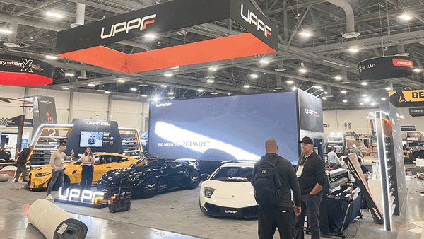 Side view of a 30x40 SEMA booth with featured vehicle sightlines, branded walls, and open visitor circulation