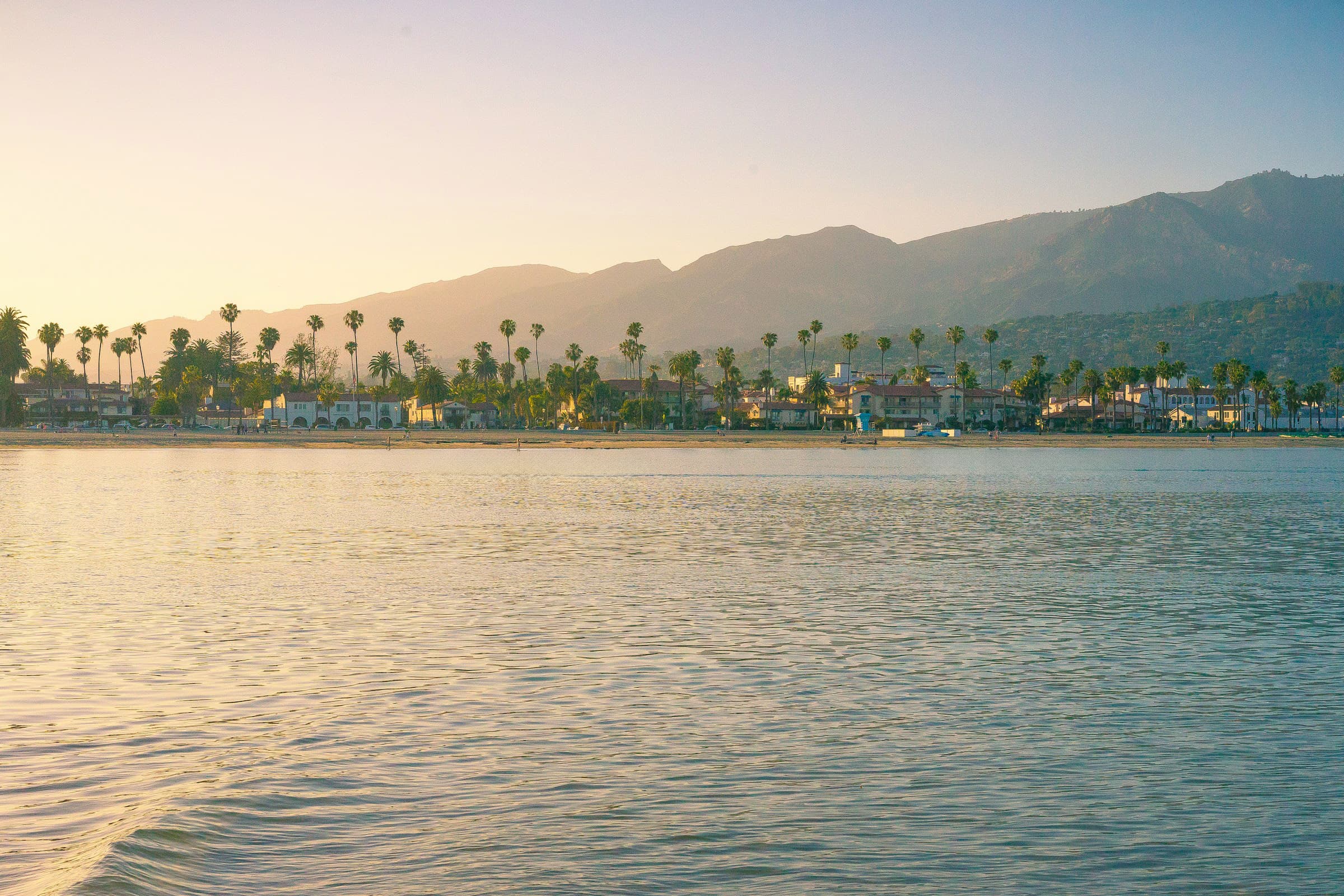 people riding boat on body of water during daytime