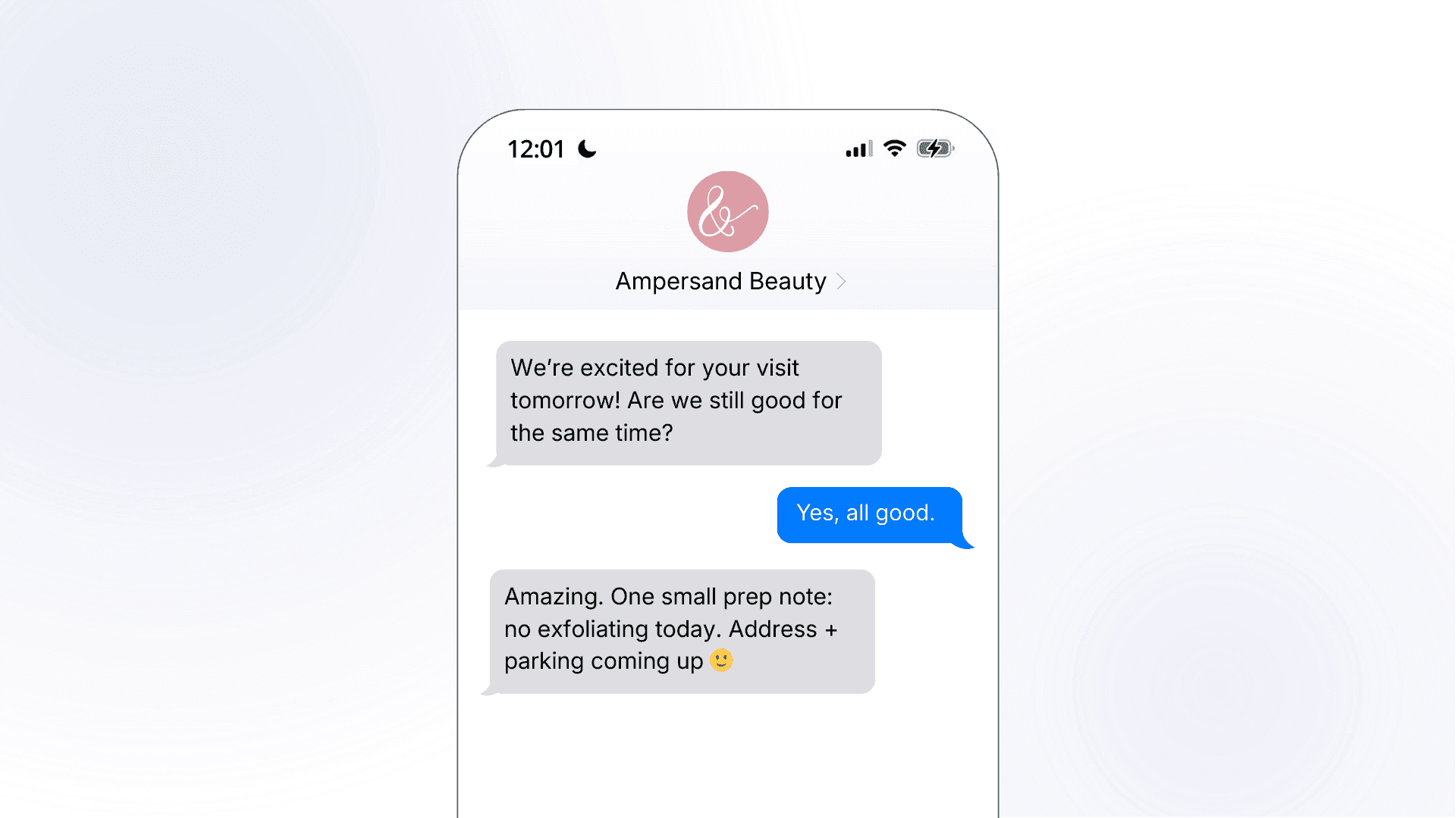 A smartphone mockup showing an Ampersand Beauty pre-appointment SMS reminder, where the salon confirms the next day's visit, gets a soft confirmation from the customer, and follows up with a prep note and promise of address and parking details.