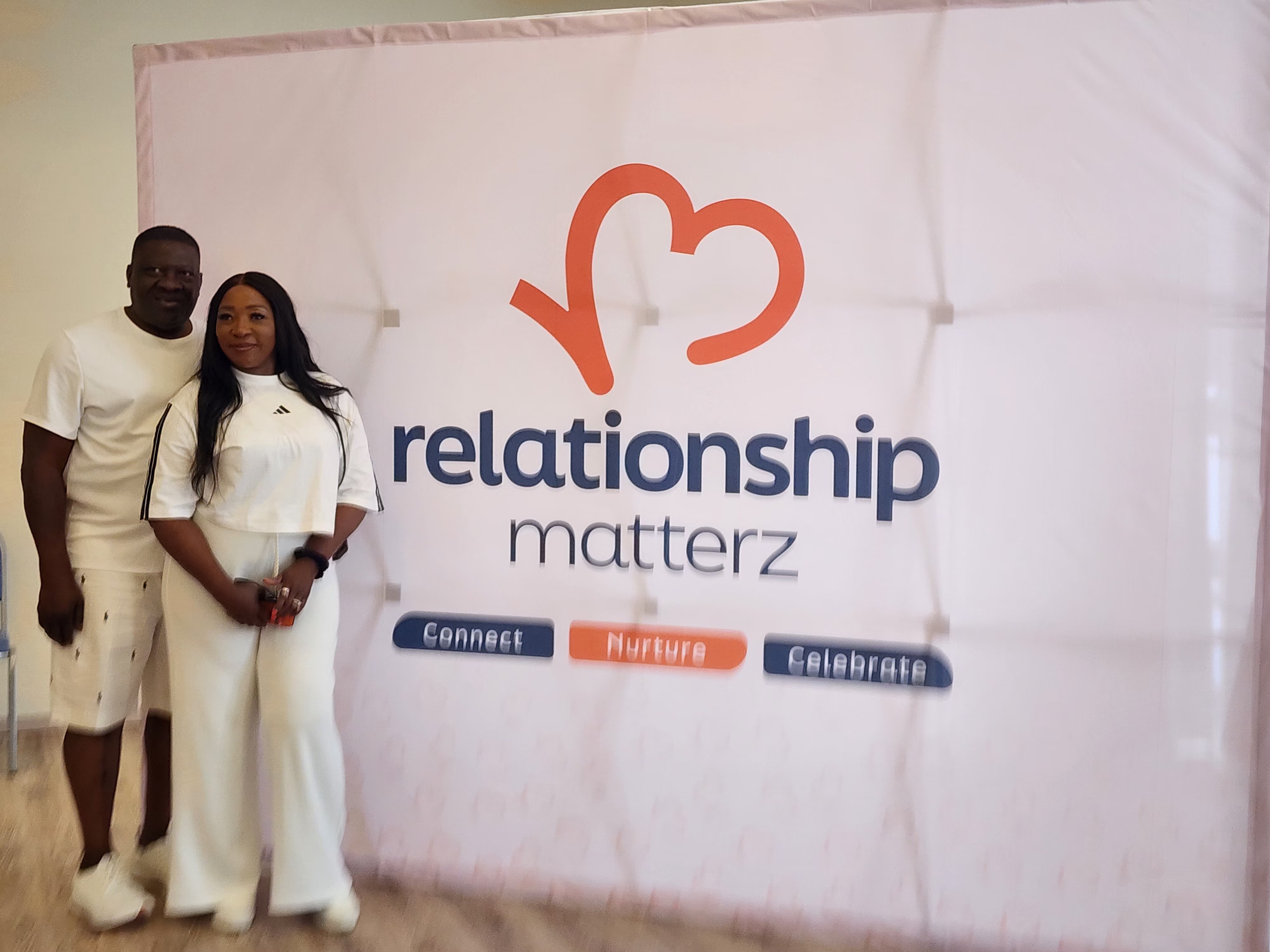 A man standing with Sufboard