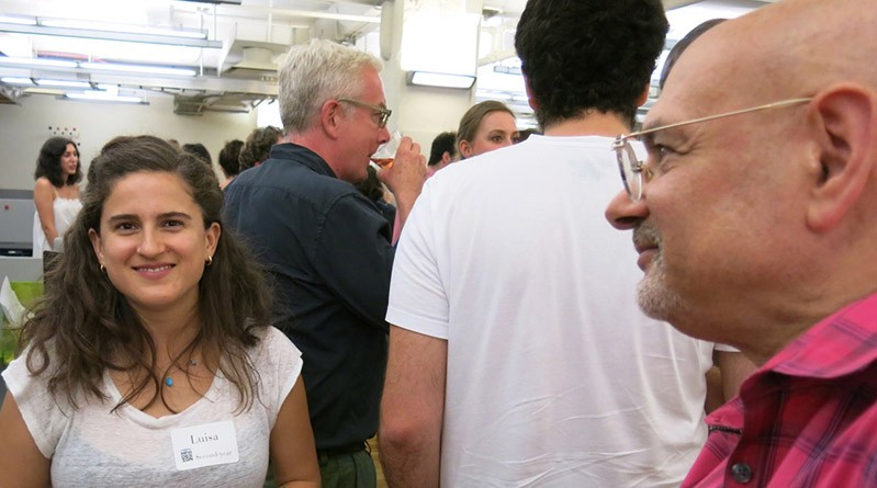 a picture with a woman and and id badge on her shirt and other person on the right side