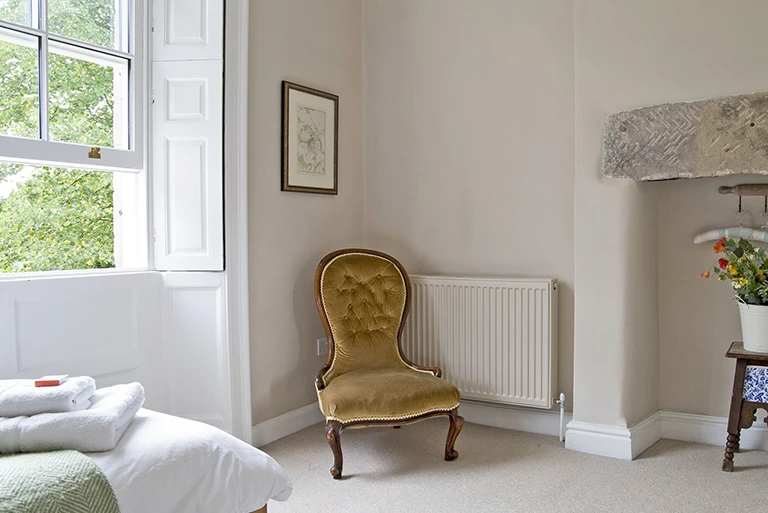 Hartingtons Heritage Tours hotel, Darley House, bedroom with small chair