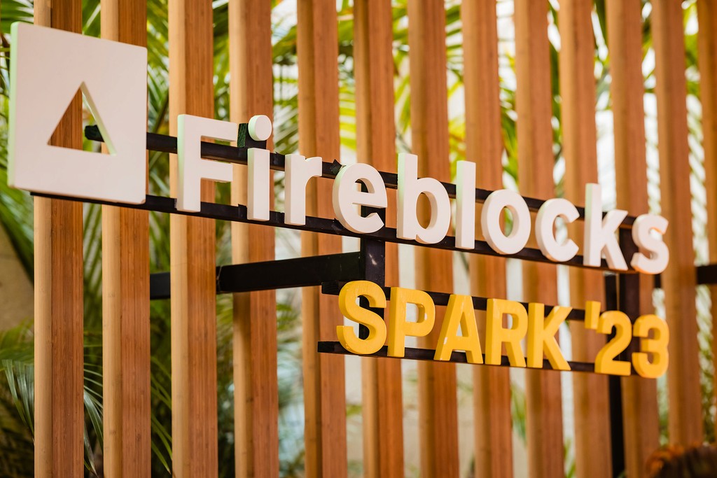 Photo of the Fireblocks SPARK logo, constructed and hanging in hotel lobby. 