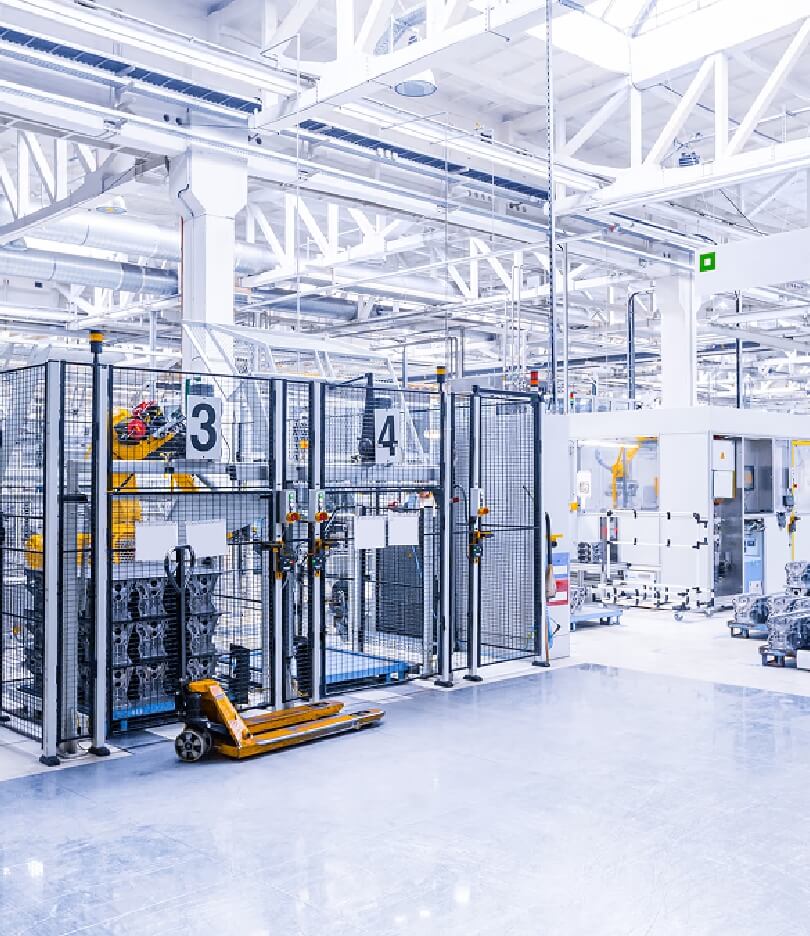 Factory interior with machinery and equipment, showcasing industrial automation.