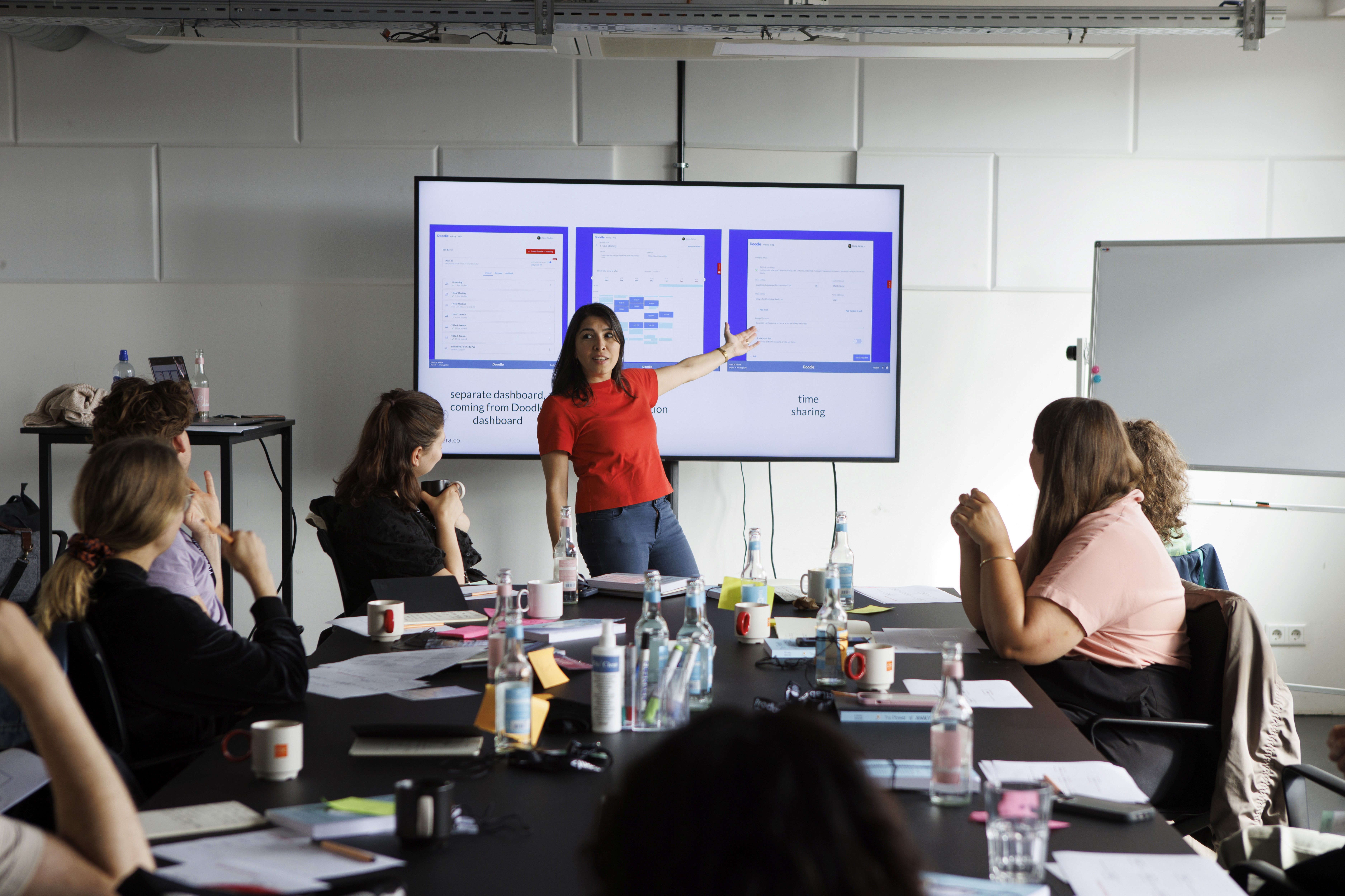 person sitting on grass and using phone